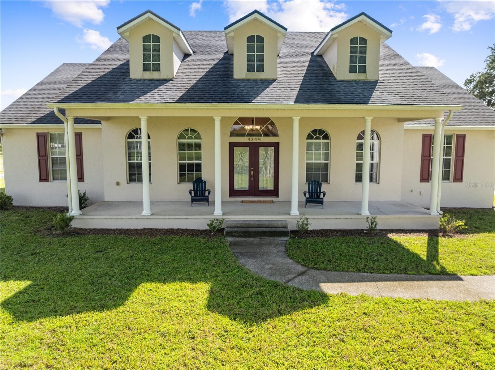 Front Exterior with a 36' x 9' Covered Front Porch - 4349 PACKARD AVE, ST CLOUD