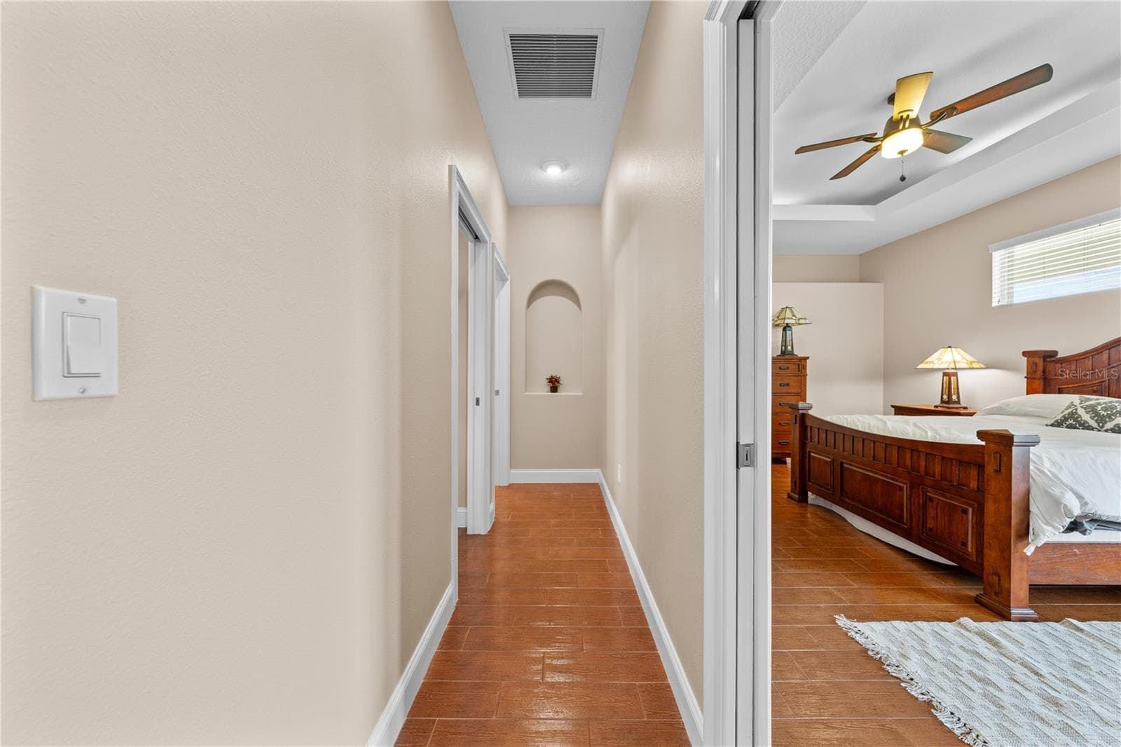 Hallway that leads to the Primary Bedroom, Guest Bedroom and Guest 1/2 bathroom. - 4349 PACKARD AVE, ST CLOUD