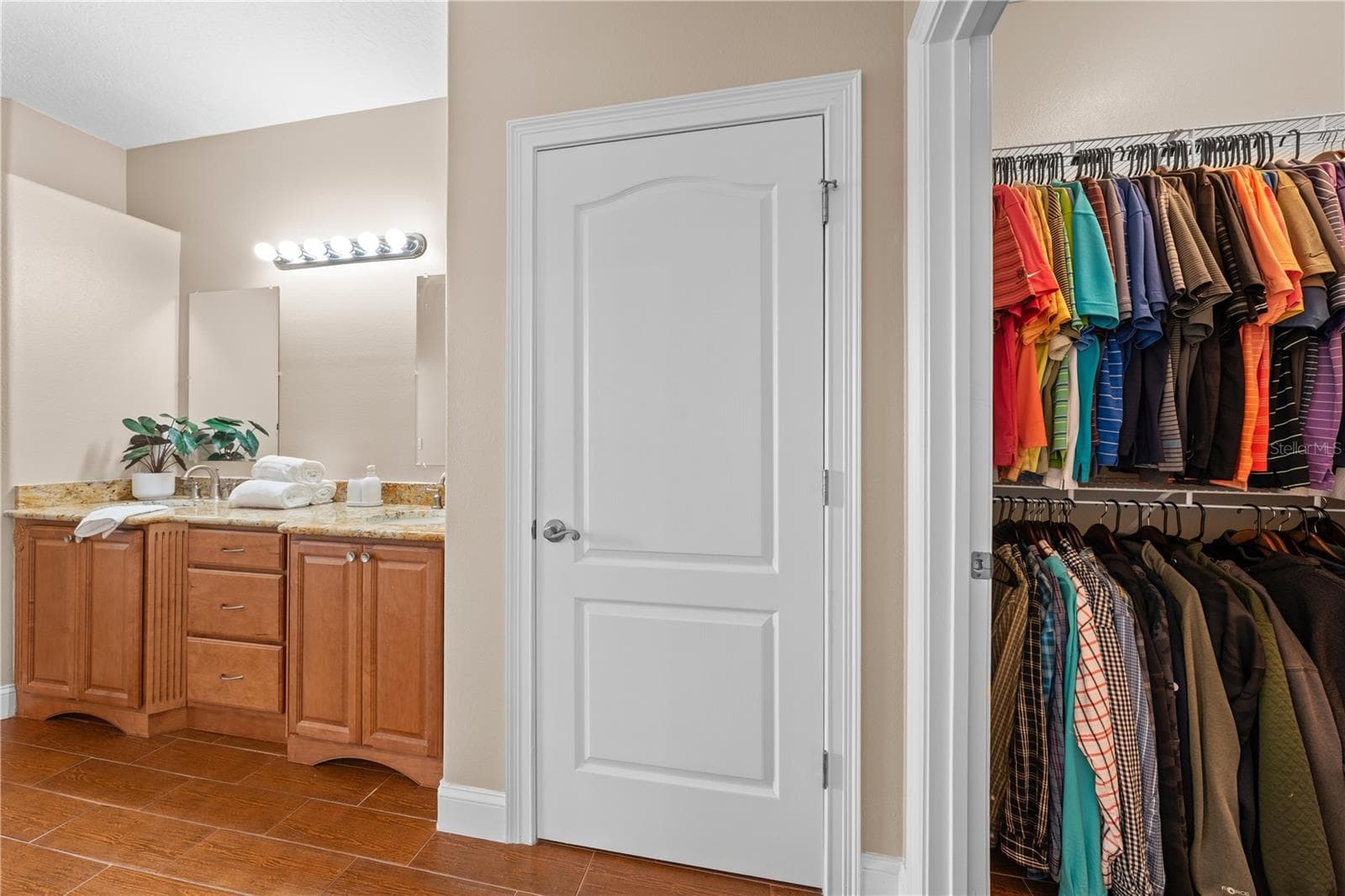 Primary Bathroom with linen closet and walk in closet. - 4349 PACKARD AVE, ST CLOUD