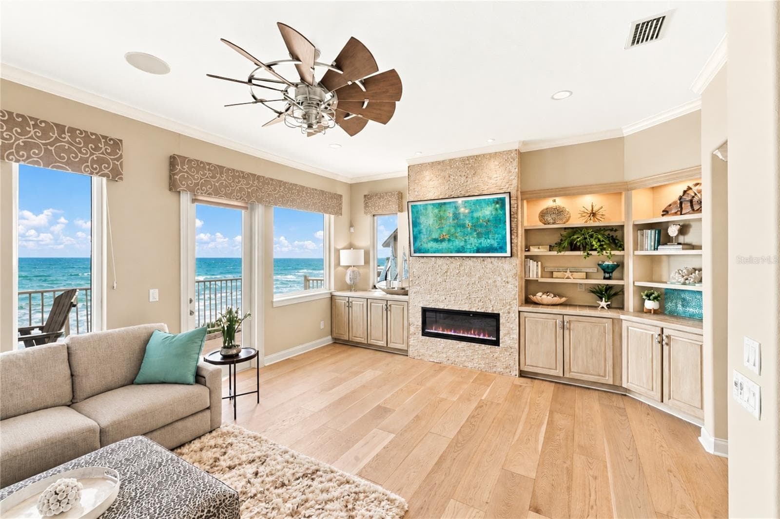 Living Area with Electric Fireplace & Built-In Shelving - 3399 N OCEAN SHORE BLVD, FLAGLER BEACH
