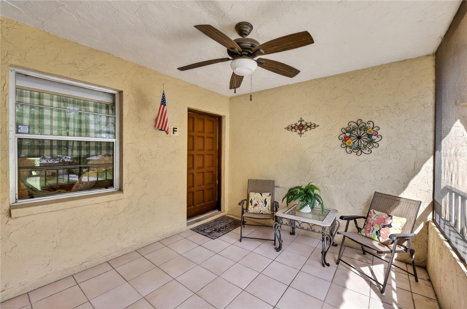 Screened front porch. - 203 RUBENS DR #F, NOKOMIS