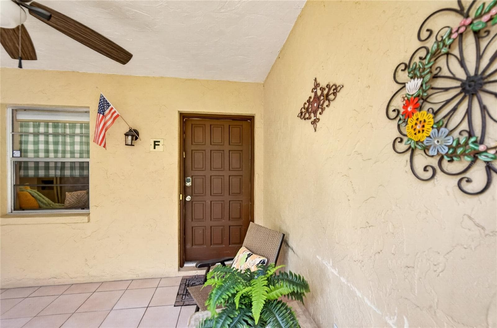 Screened front porch, front door to the unit. - 203 RUBENS DR #F, NOKOMIS