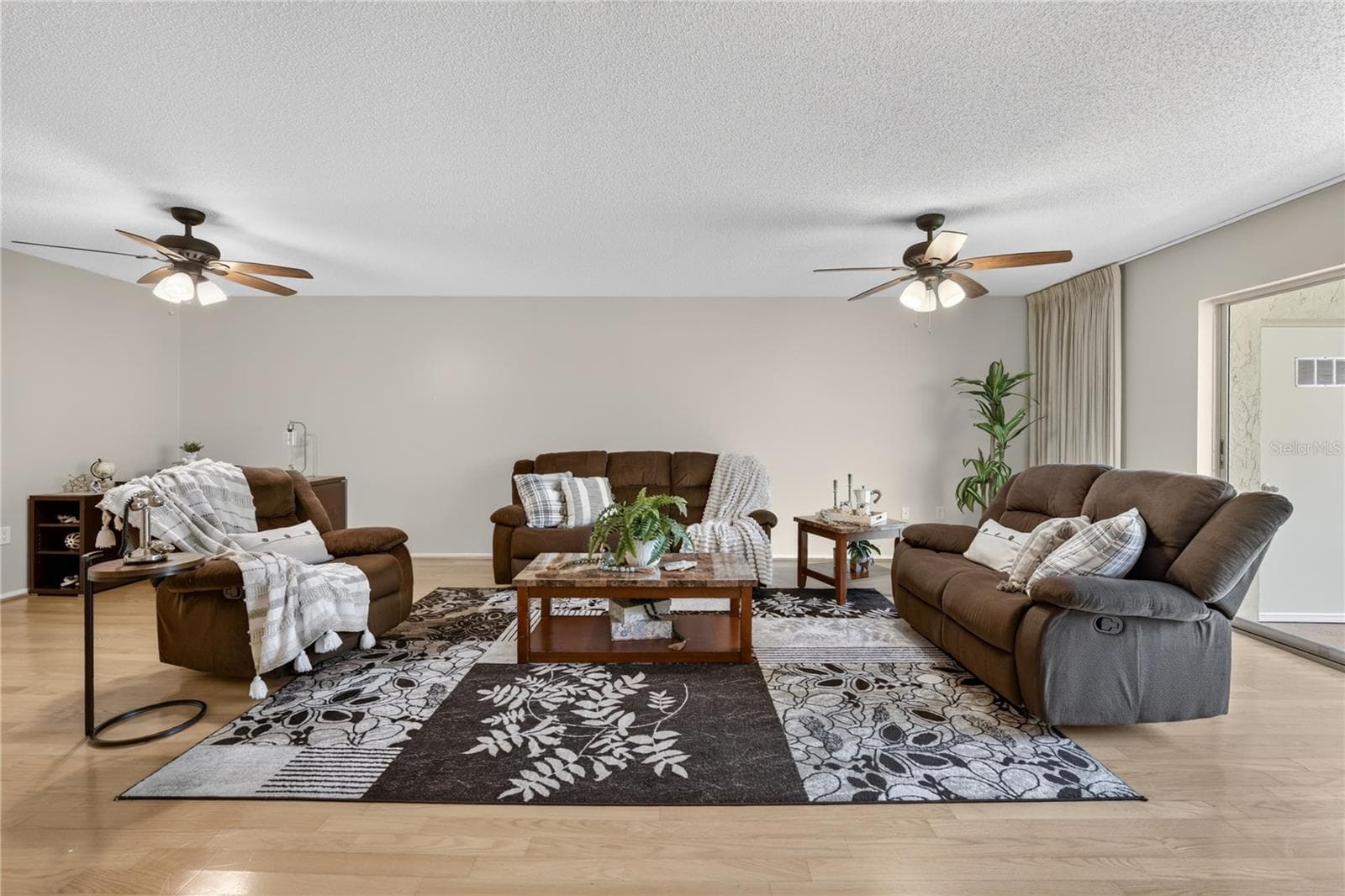 Living room Living room with sliding doors to the screened lanai. - 203 RUBENS DR #F, NOKOMIS