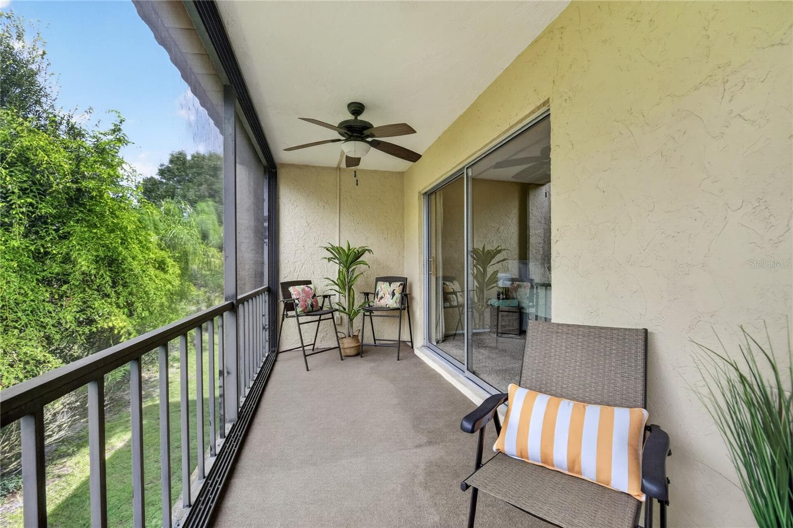 Large screened backdoor lanai- view of the Oscar Scherer State Park. - 203 RUBENS DR #F, NOKOMIS