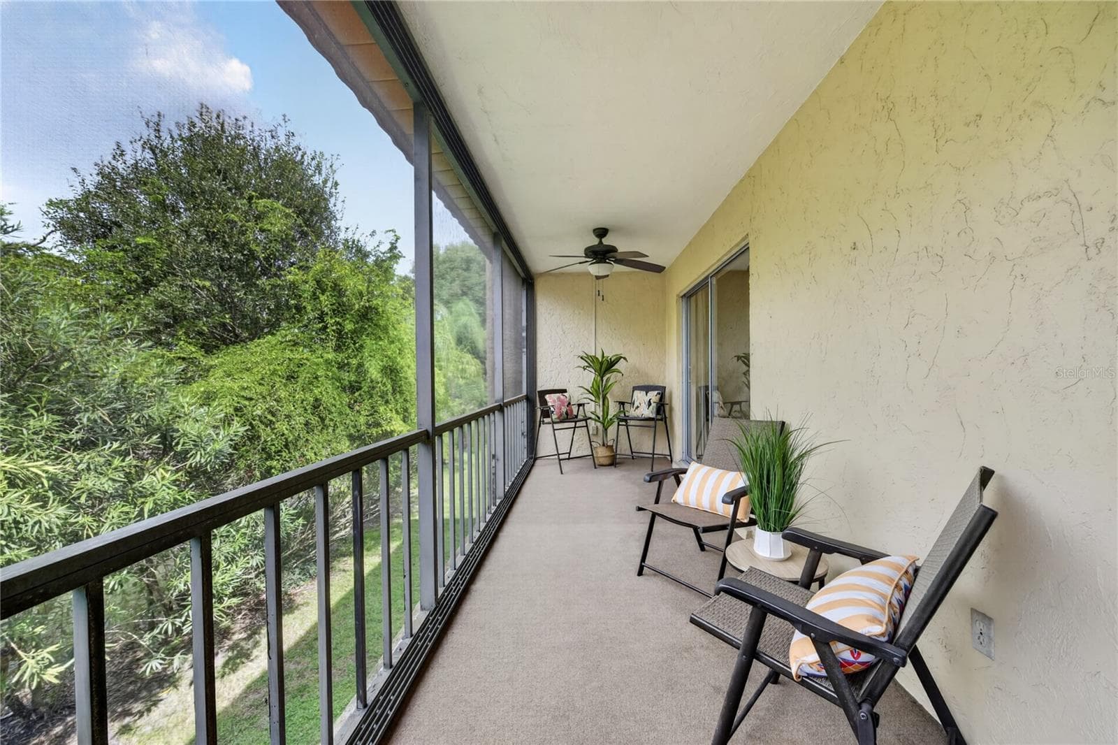 Large screened backdoor lanai - view of the Oscar Scherer State Park. - 203 RUBENS DR #F, NOKOMIS
