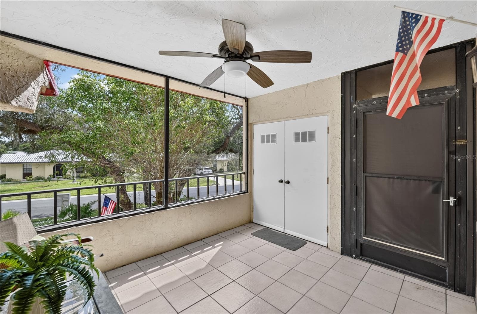 Front porch with laundry closet. - 203 RUBENS DR #F, NOKOMIS
