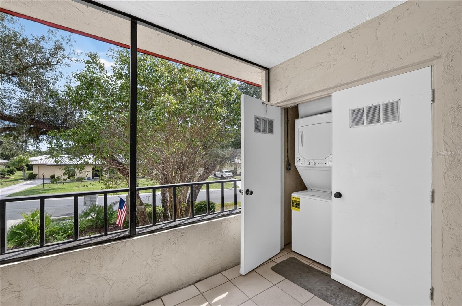 Front porch with laundry closet. - 203 RUBENS DR #F, NOKOMIS
