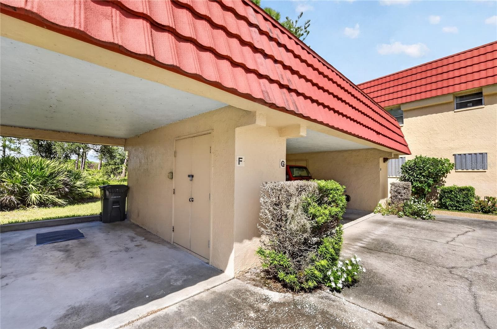 Assigned carport with storage. - 203 RUBENS DR #F, NOKOMIS