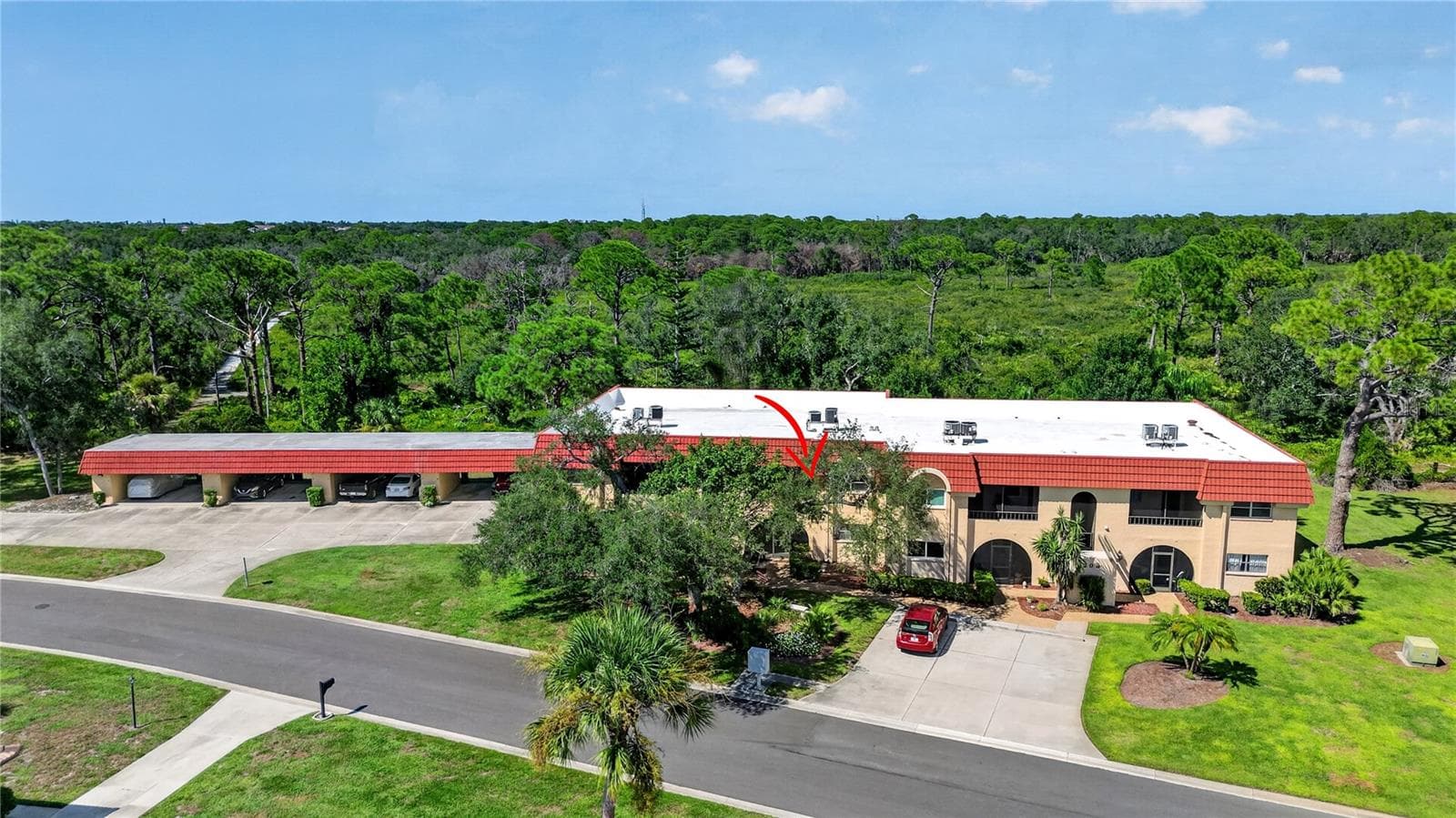 Aerial photo of the building and Oscar Sherer State park. - 203 RUBENS DR #F, NOKOMIS