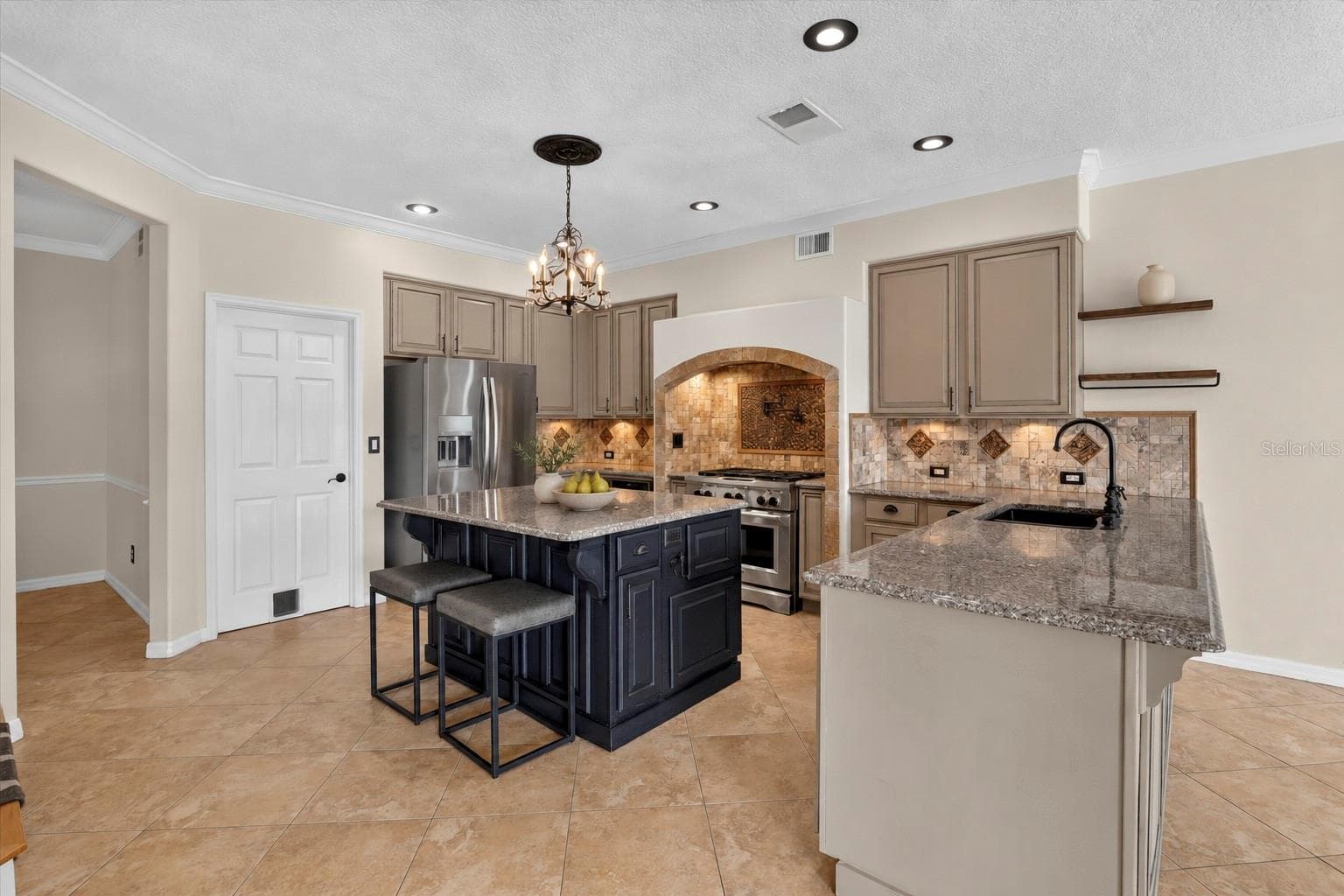 Alternate view of the kitchen island and dining space. - 2109 WEMBLEY PL, OVIEDO
