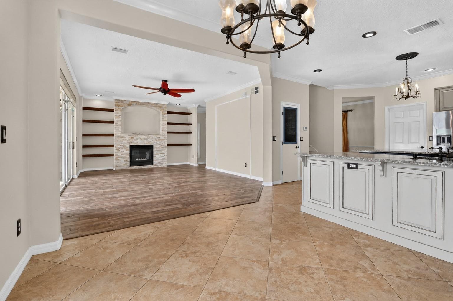 Not staged: Open living area shown without furniture. - 2109 WEMBLEY PL, OVIEDO