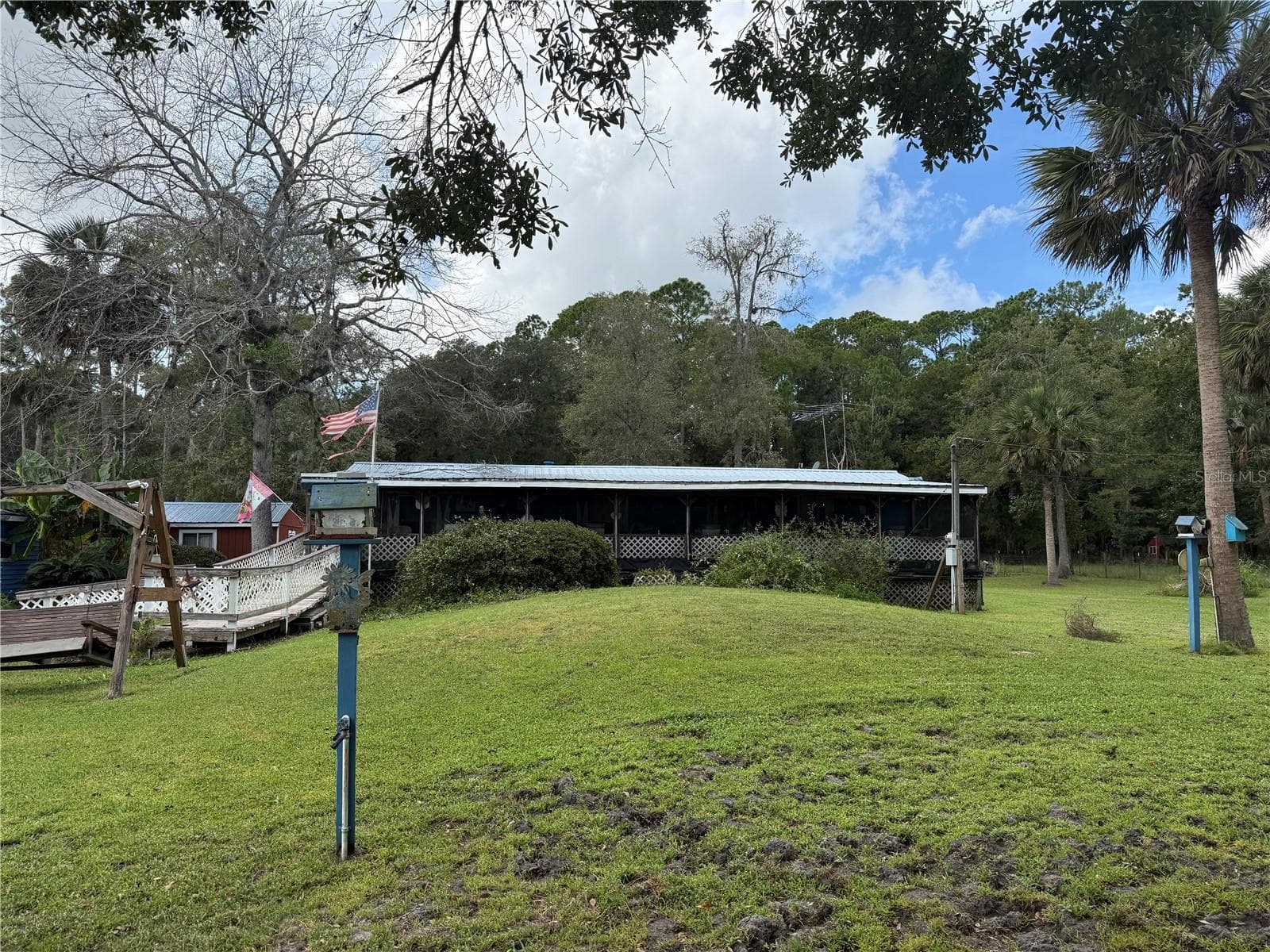 Front of the home.  The screen porch gives privacy - 1844 PAPAYA ST, BUNNELL