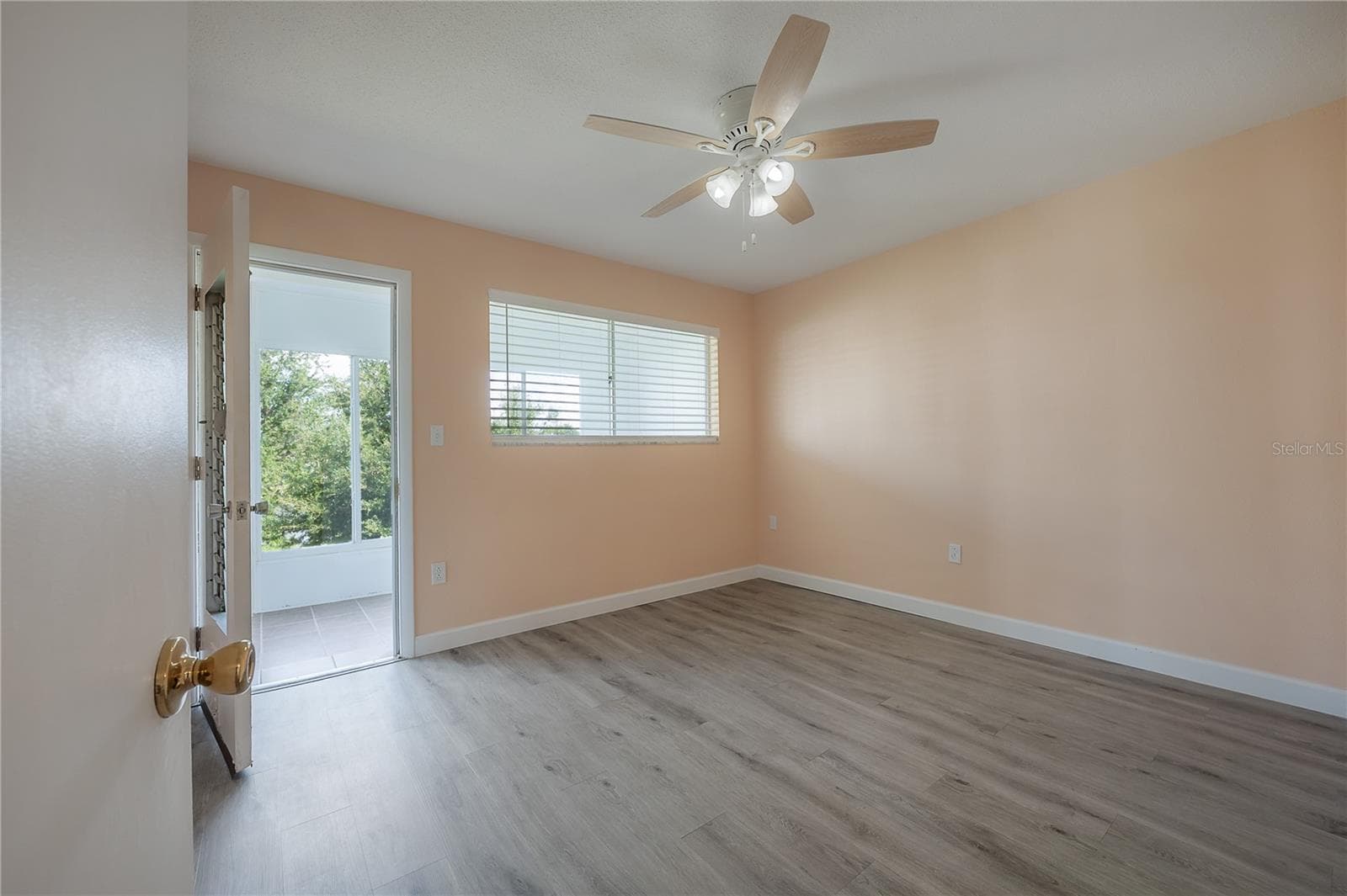 Second Bedroom leading to lanai - 8055 112TH ST #205, SEMINOLE