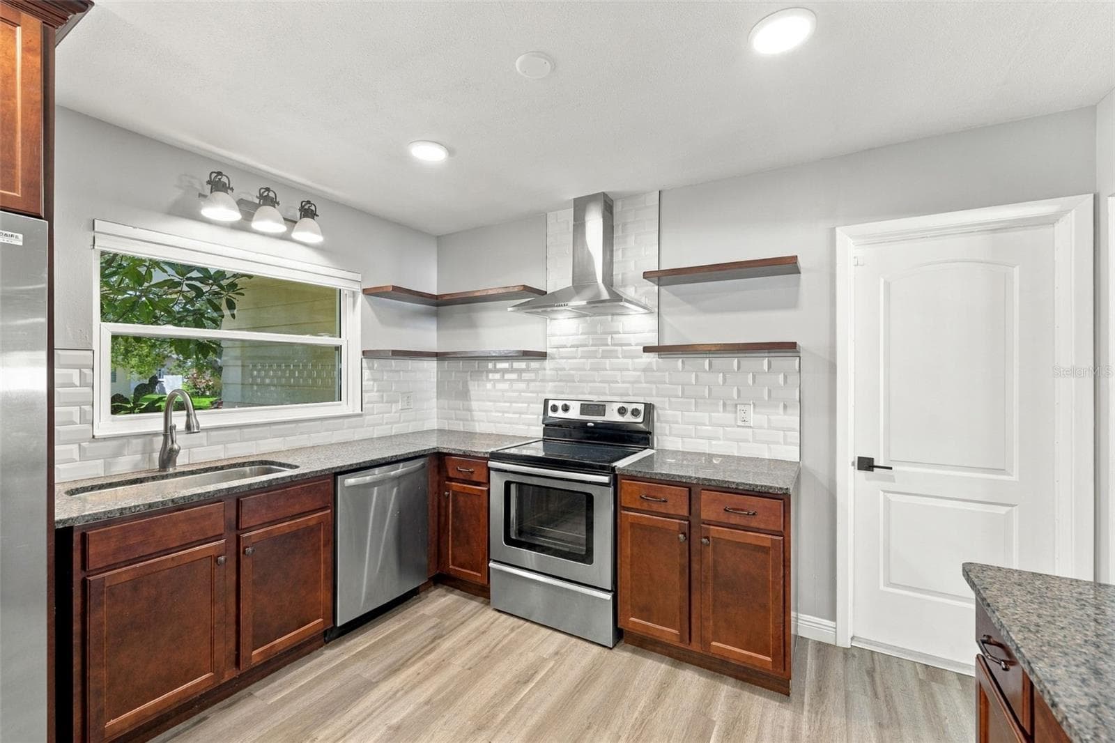 Access to the garage and laundry through the door on the right. - 2260 SAINT CHARLES DR, CLEARWATER
