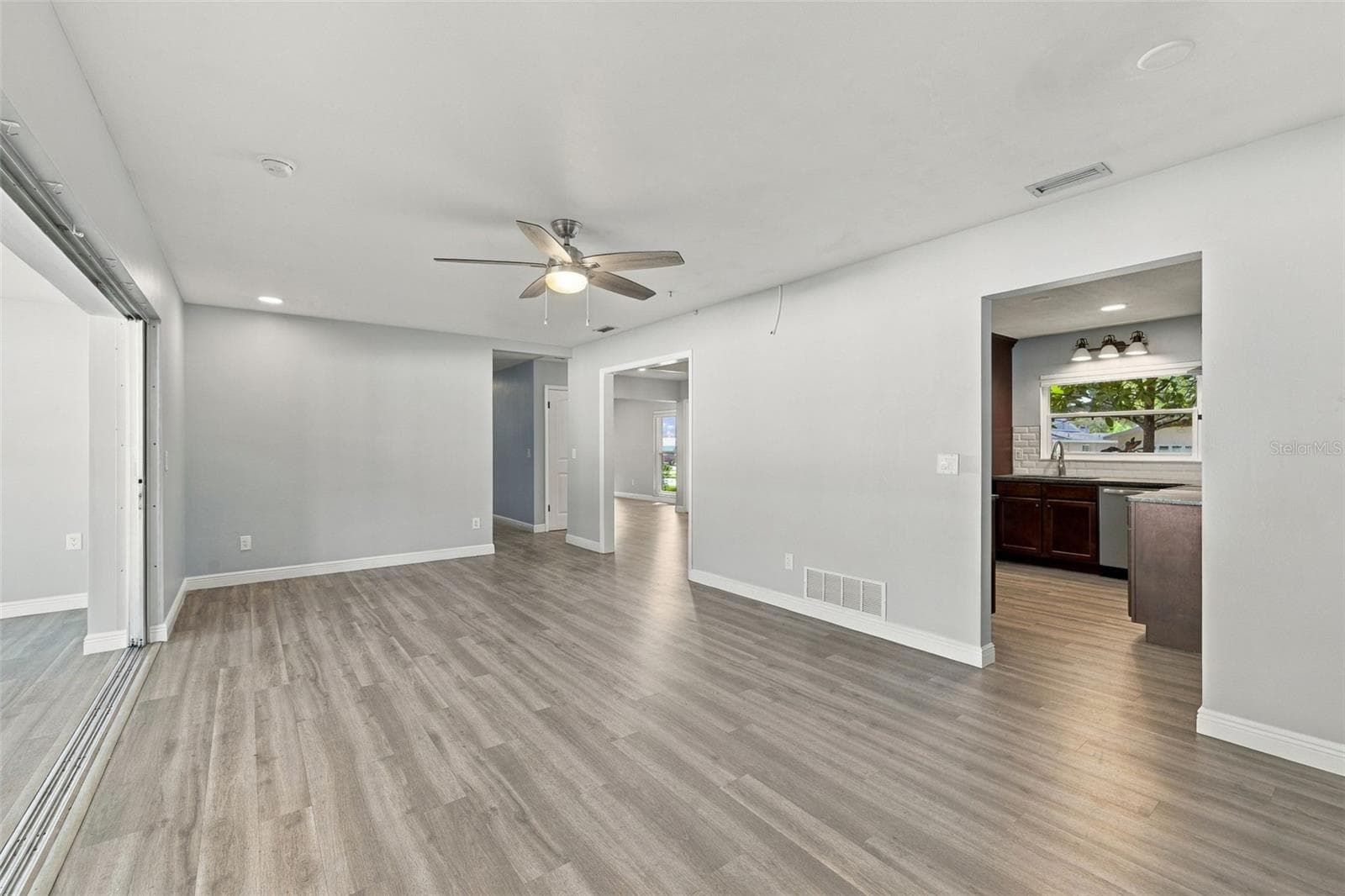The hall on the far side leads to two additional bedrooms that share a bathroom. The split floor plan is great for creating separation and privacy for the bedrooms. - 2260 SAINT CHARLES DR, CLEARWATER