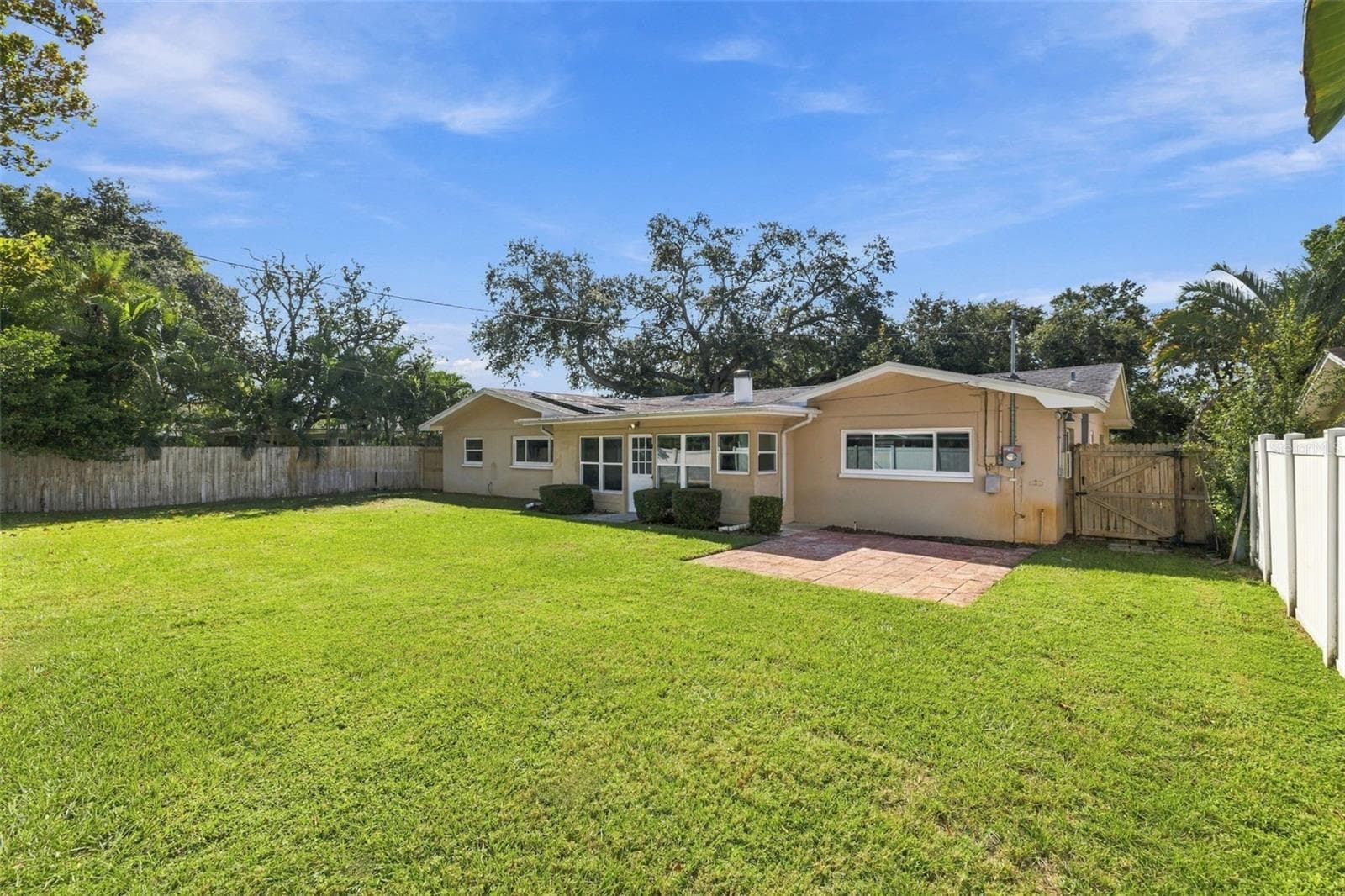 A view of the backyard and rear of the home. - 2260 SAINT CHARLES DR, CLEARWATER