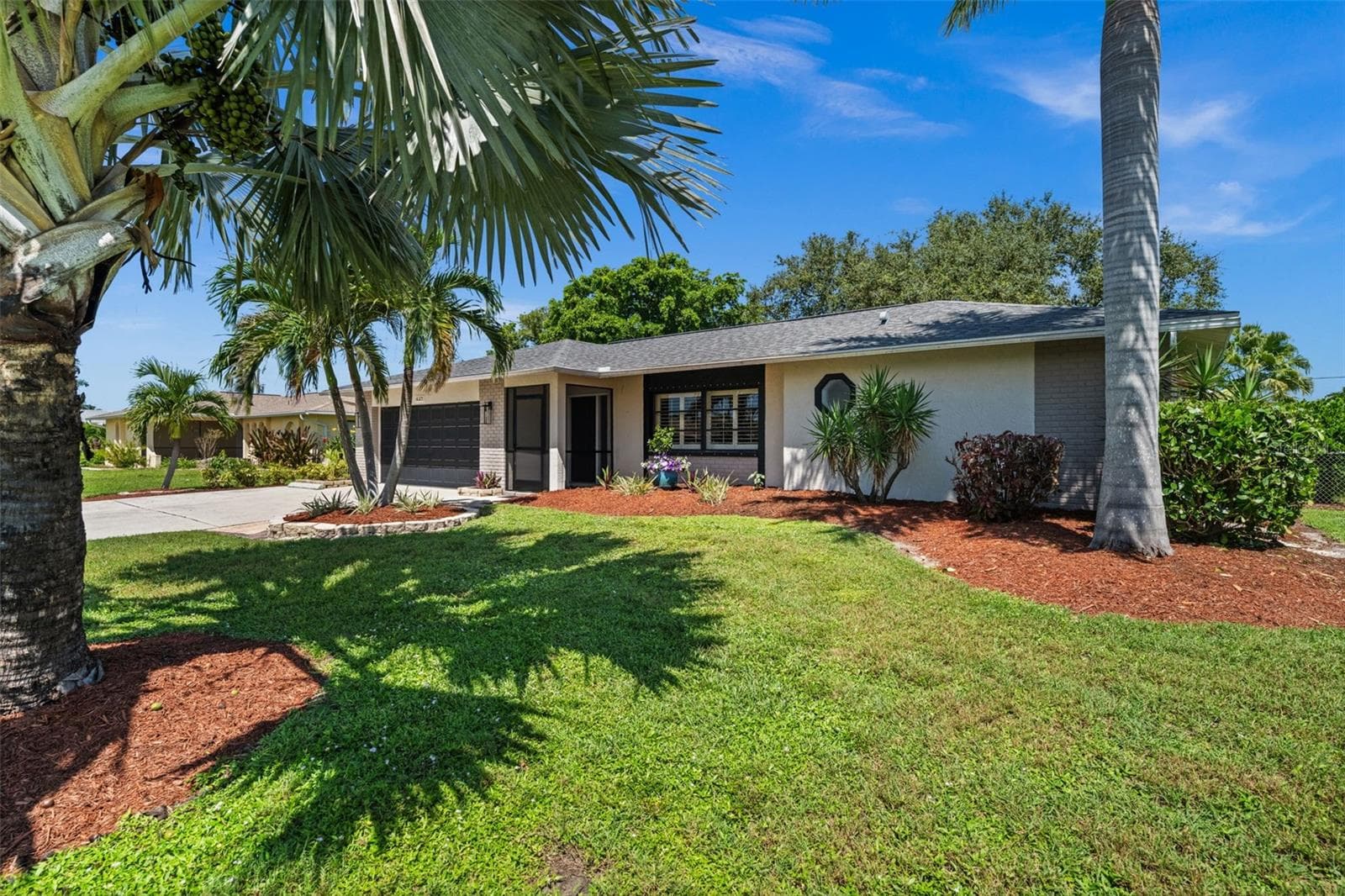 A beautifully landscaped yard - 427 SW 34TH ST, CAPE CORAL