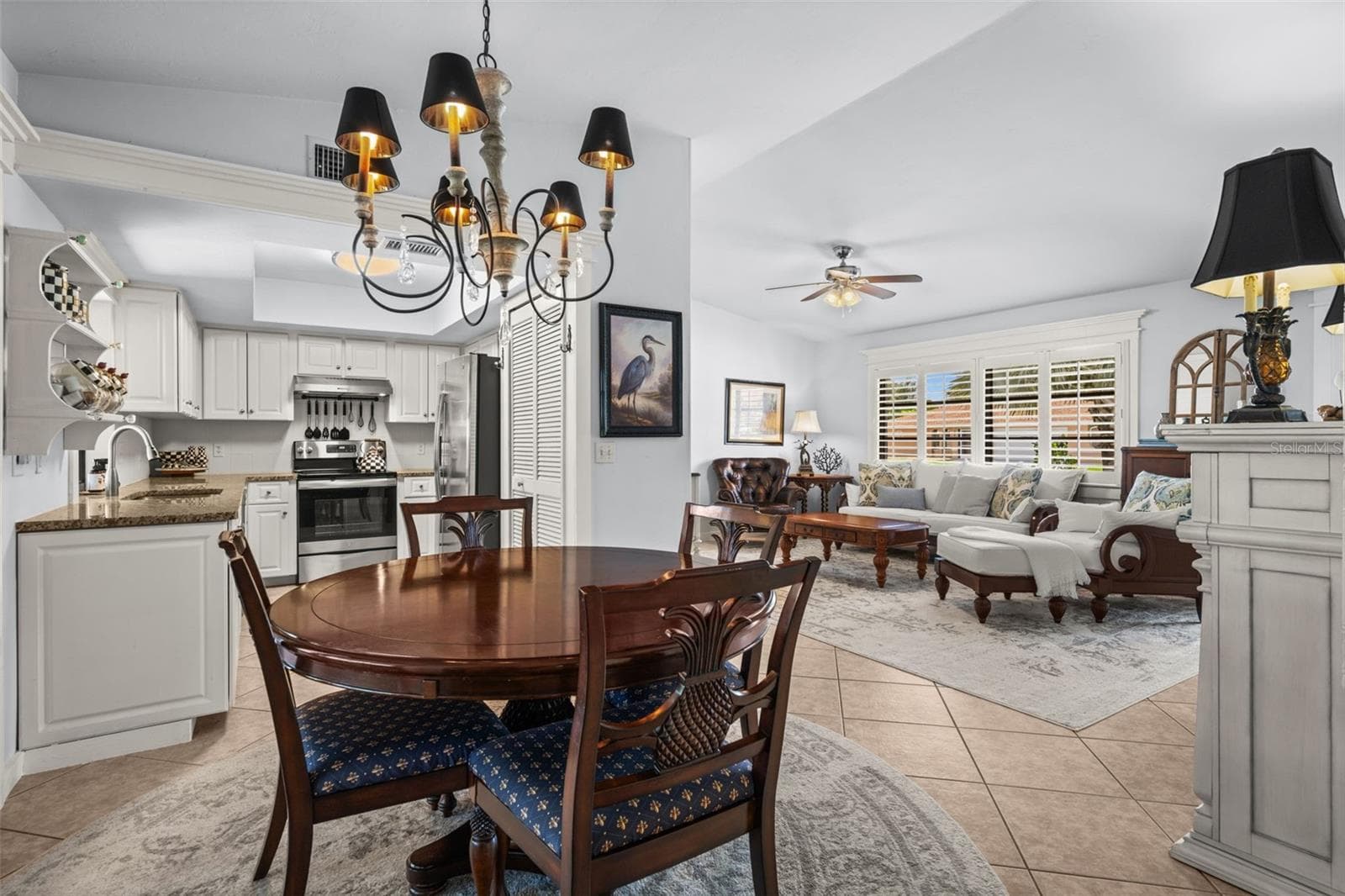 Dining overlooking the living room and kitchen - 427 SW 34TH ST, CAPE CORAL