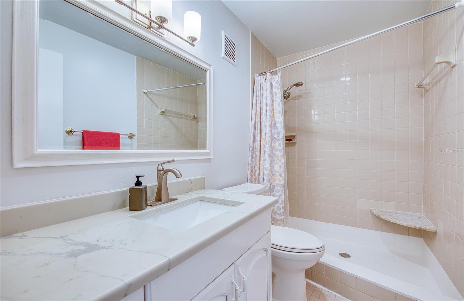 updated shower with bench - 4681 1ST ST NE #301, ST PETERSBURG