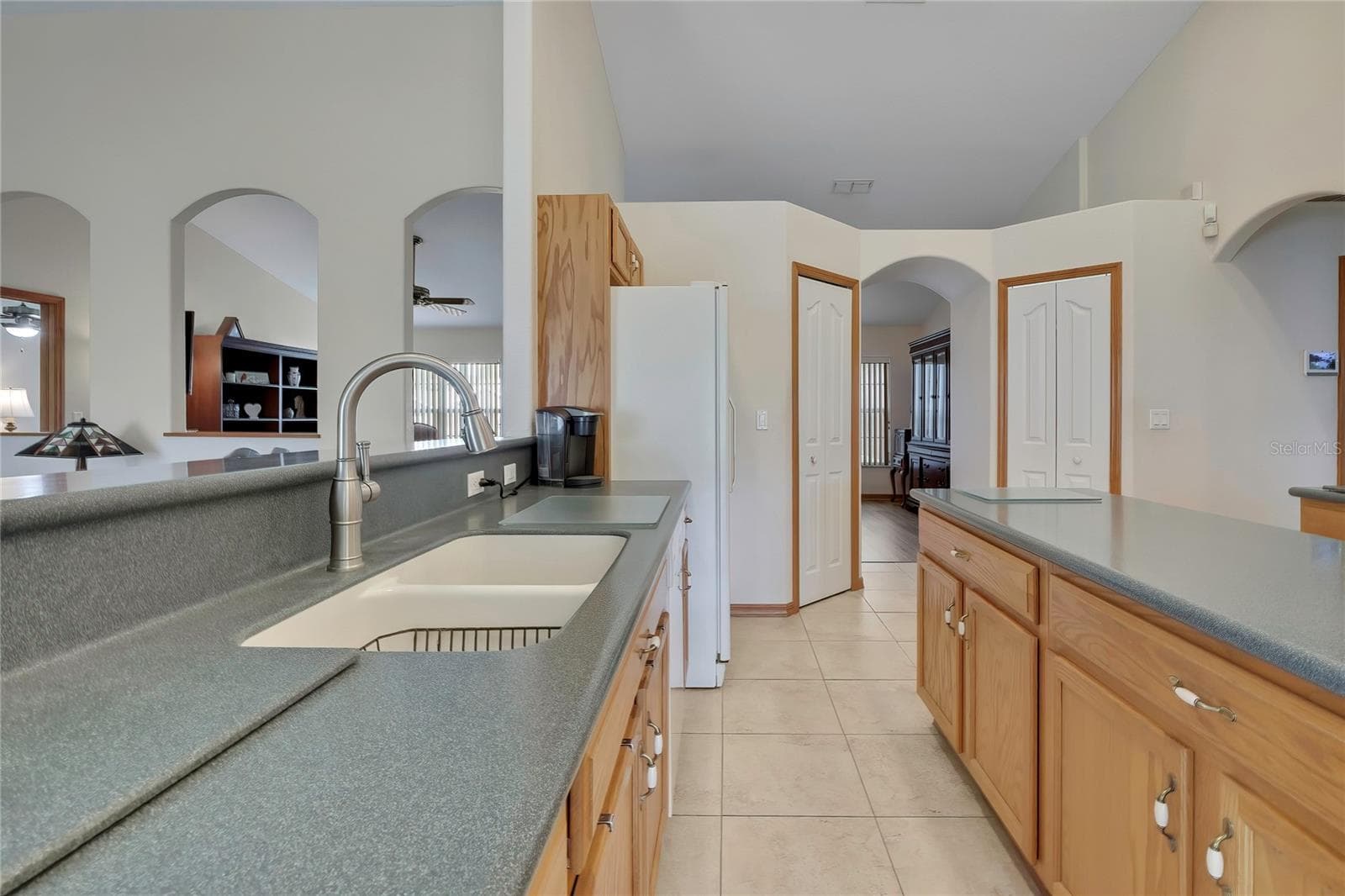 TWO walk-in pantries! Center island with storage, Corian counters, wood cabinets - 4583 GONDOLIER RD, SPRING HILL