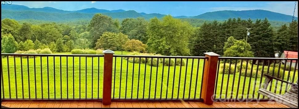 Off the back cathedral-covered porch, centered on the living room inside! Amazing natural light cascades through! - 93 Orchard Hill, Saluda