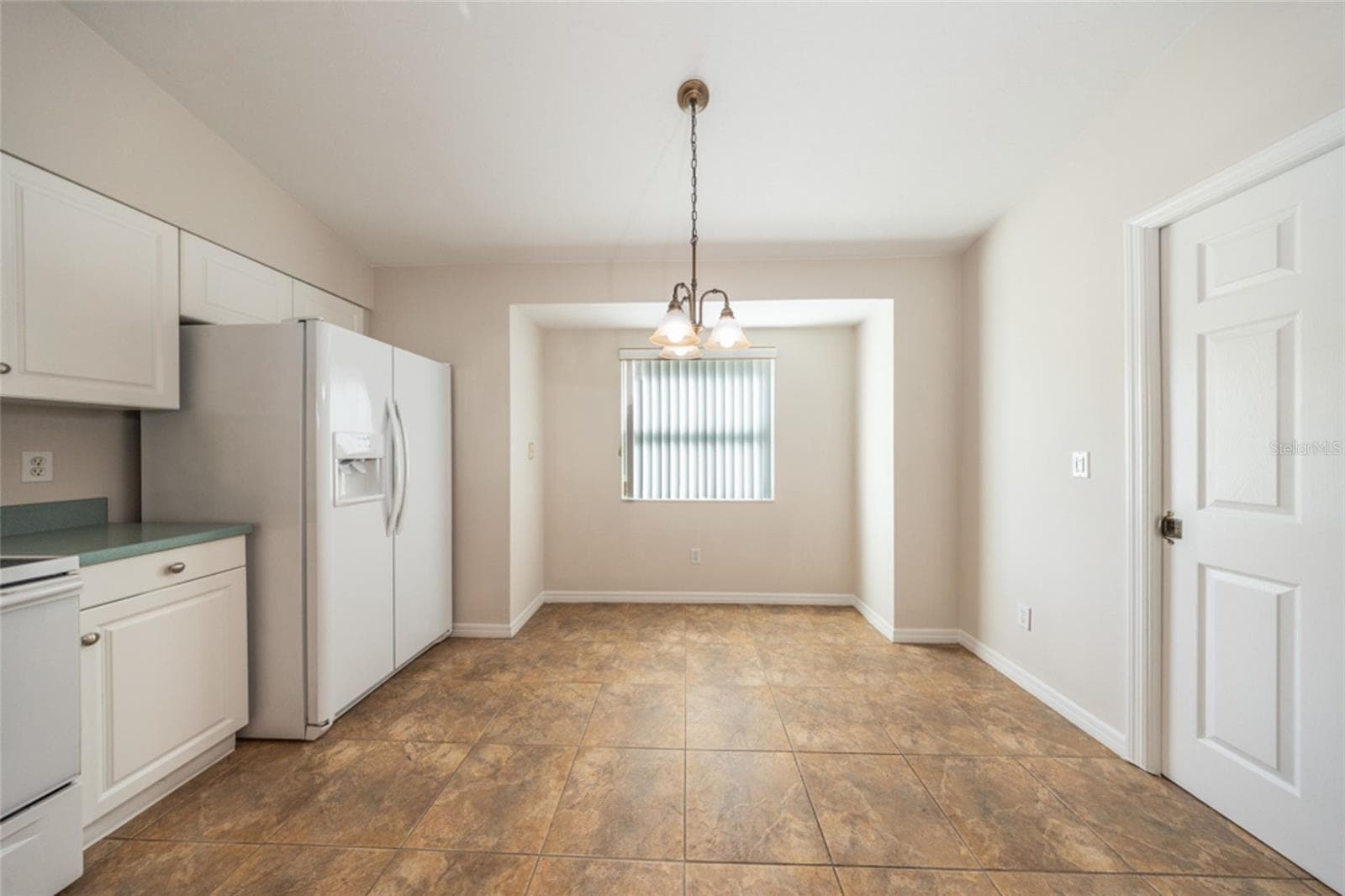 Great spot by the window for meals. Laundry room is to the right. - 141 BREN MAR LN, PALM COAST