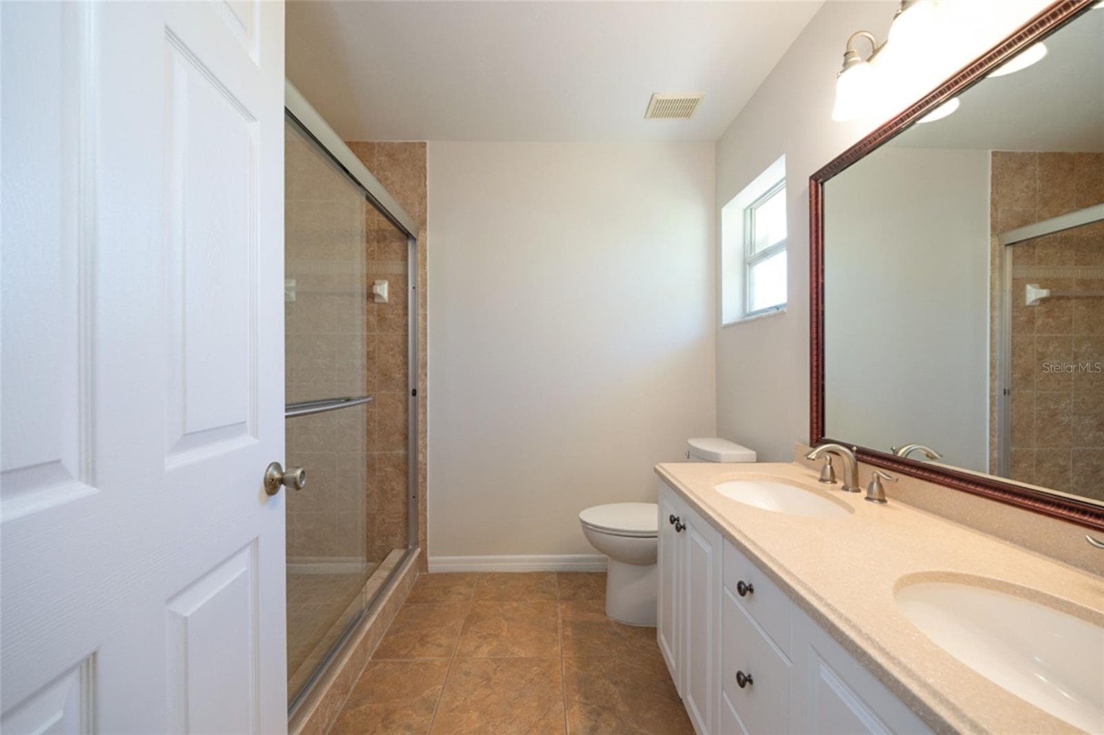 Primary bath has dual vanities and updated shower. - 141 BREN MAR LN, PALM COAST
