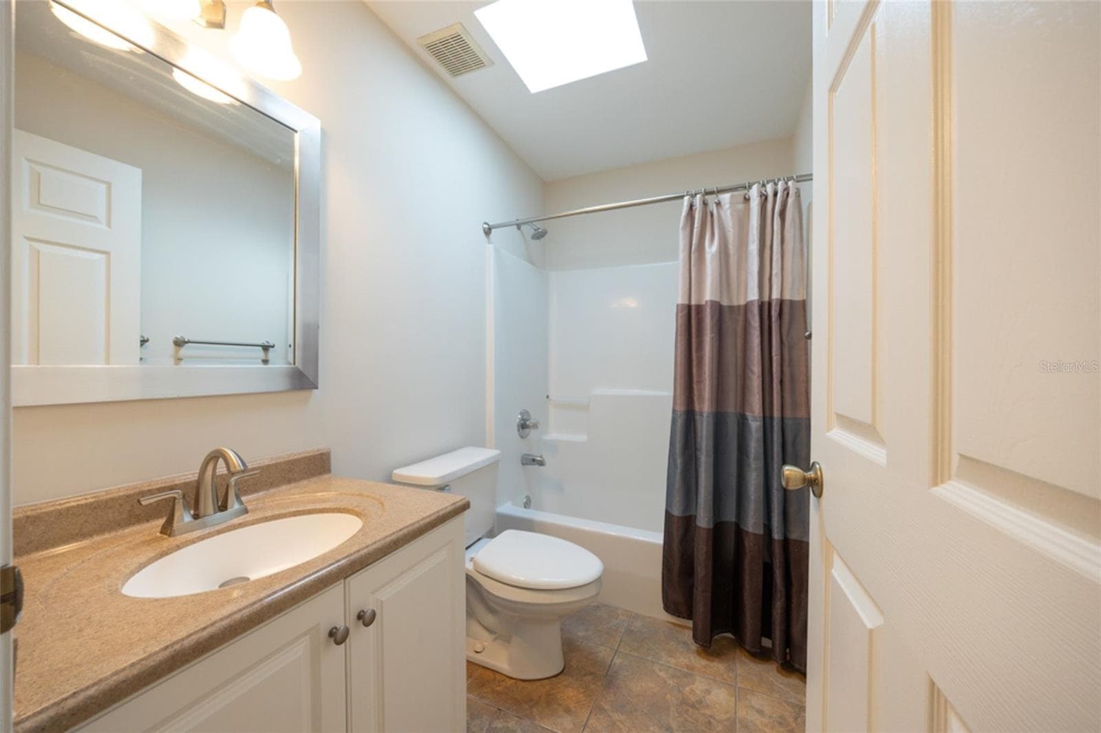 Guest bathroom has solid surface countertops and easy clean shower - 141 BREN MAR LN, PALM COAST