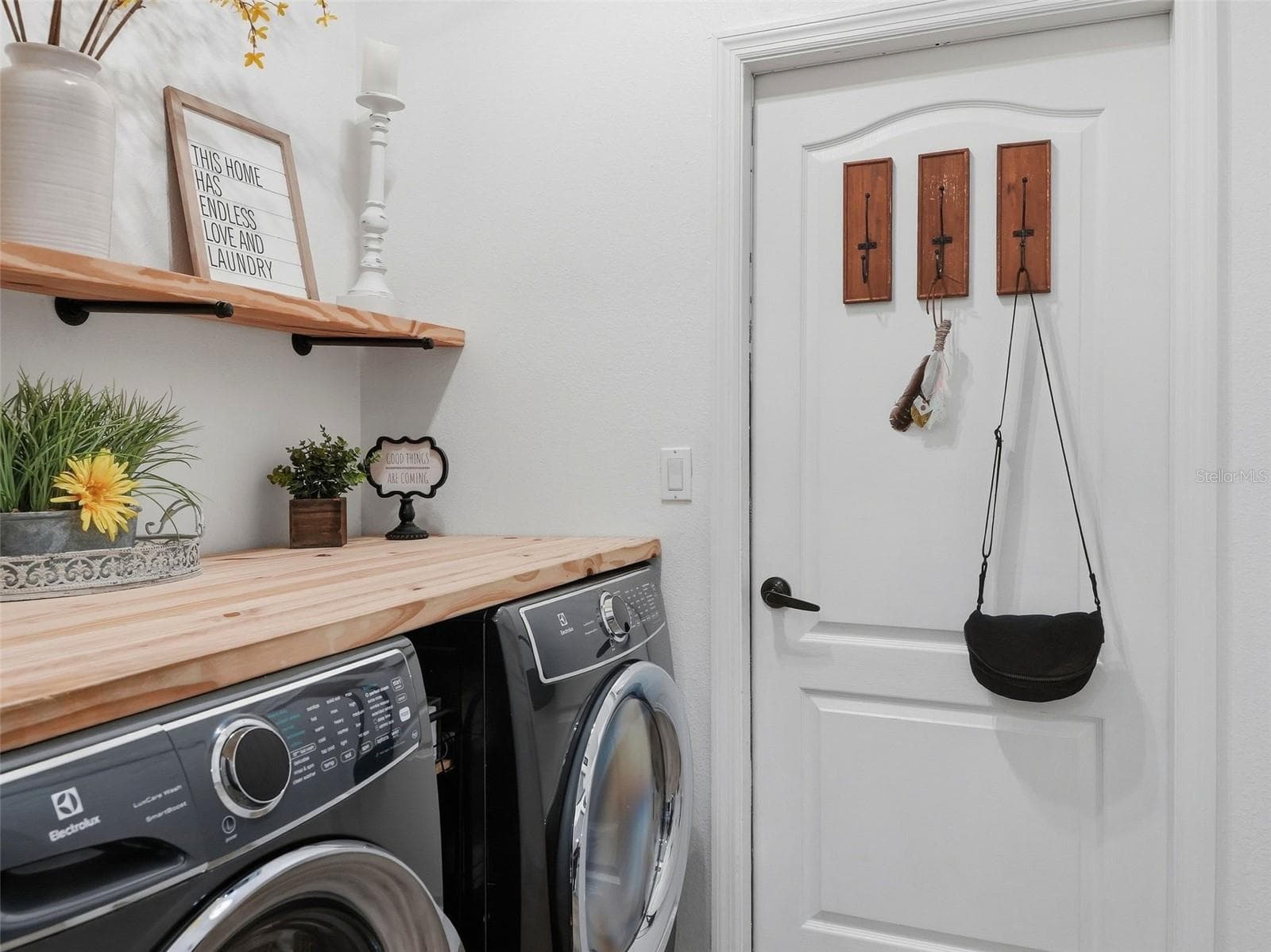 Butcher block counter and shelving in the laundry room. - 13396 TWINBERRY DR, SPRING HILL