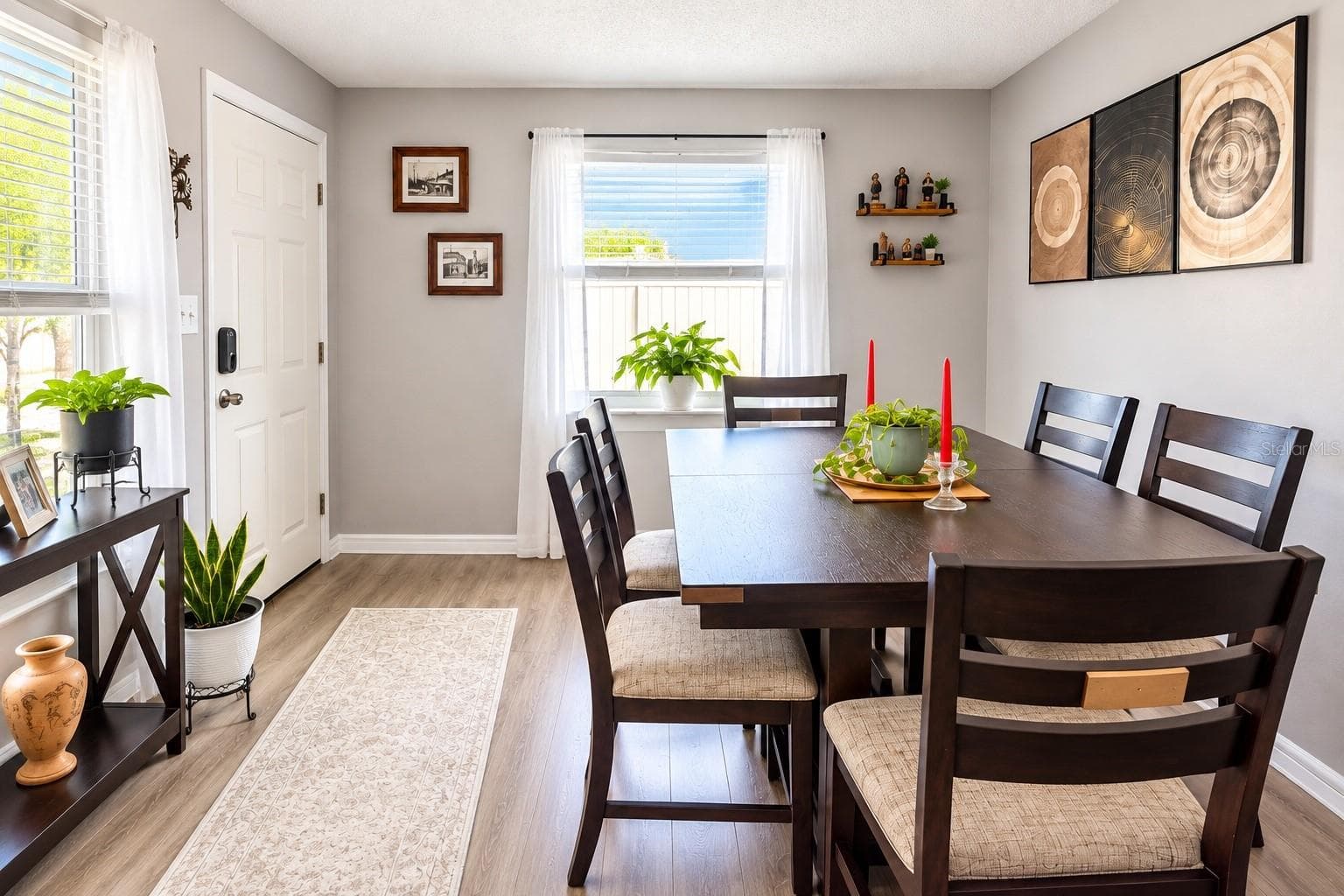 Spacious dining area or second living room featuring luxury vinyl plank flooring and smooth ceilings. - 8514 93RD AVE, SEMINOLE
