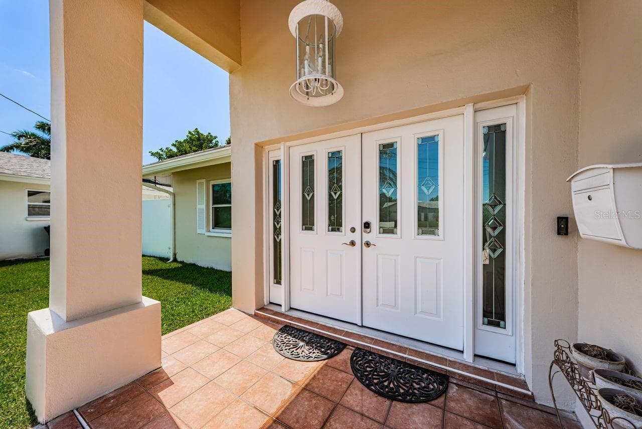 Covered front entry - 4280 13TH LN NE, ST PETERSBURG