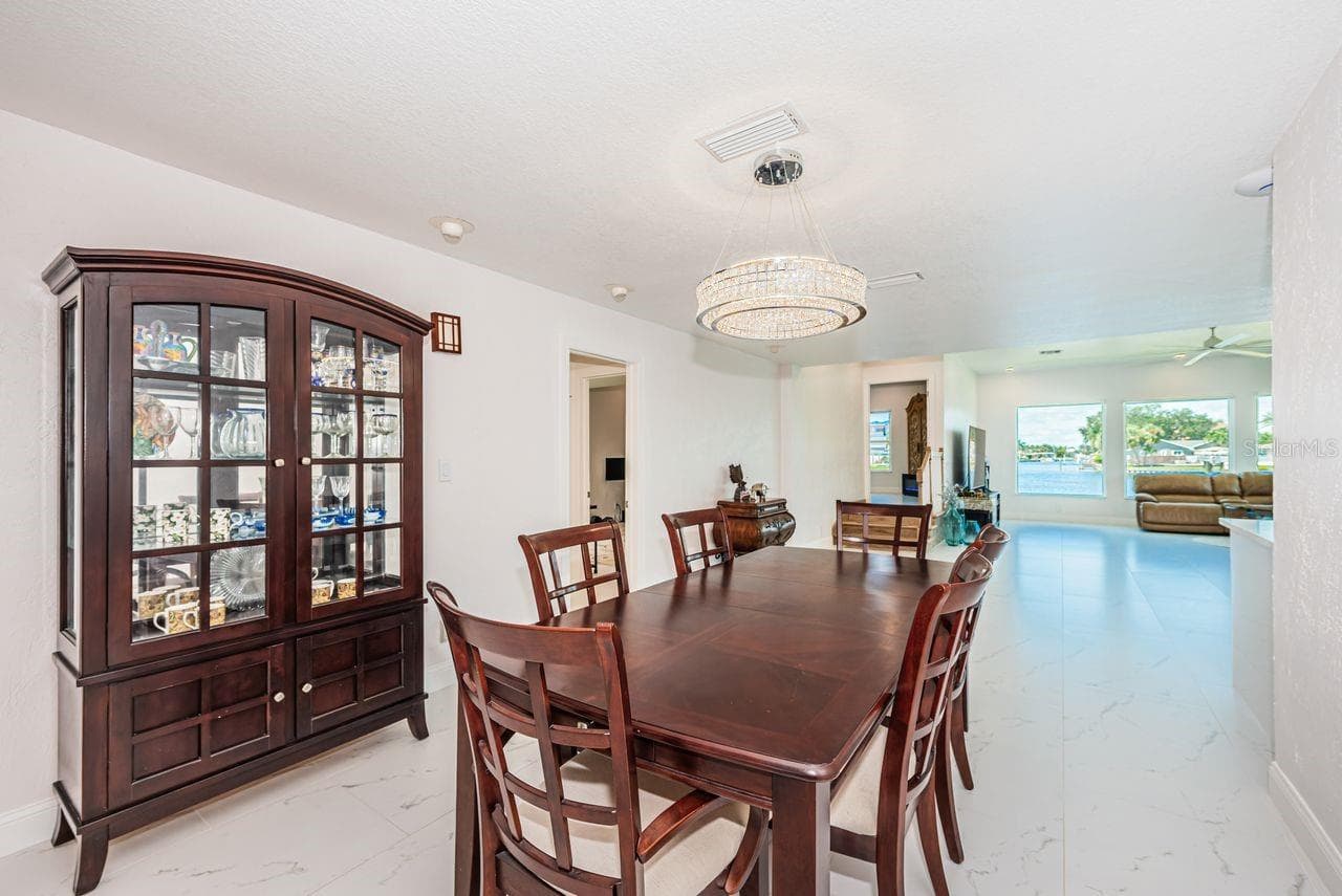 Dining opens up to expansive living space - 4280 13TH LN NE, ST PETERSBURG
