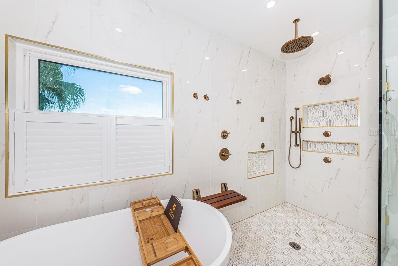 Tub with large modern shower and natural lighting - 4280 13TH LN NE, ST PETERSBURG