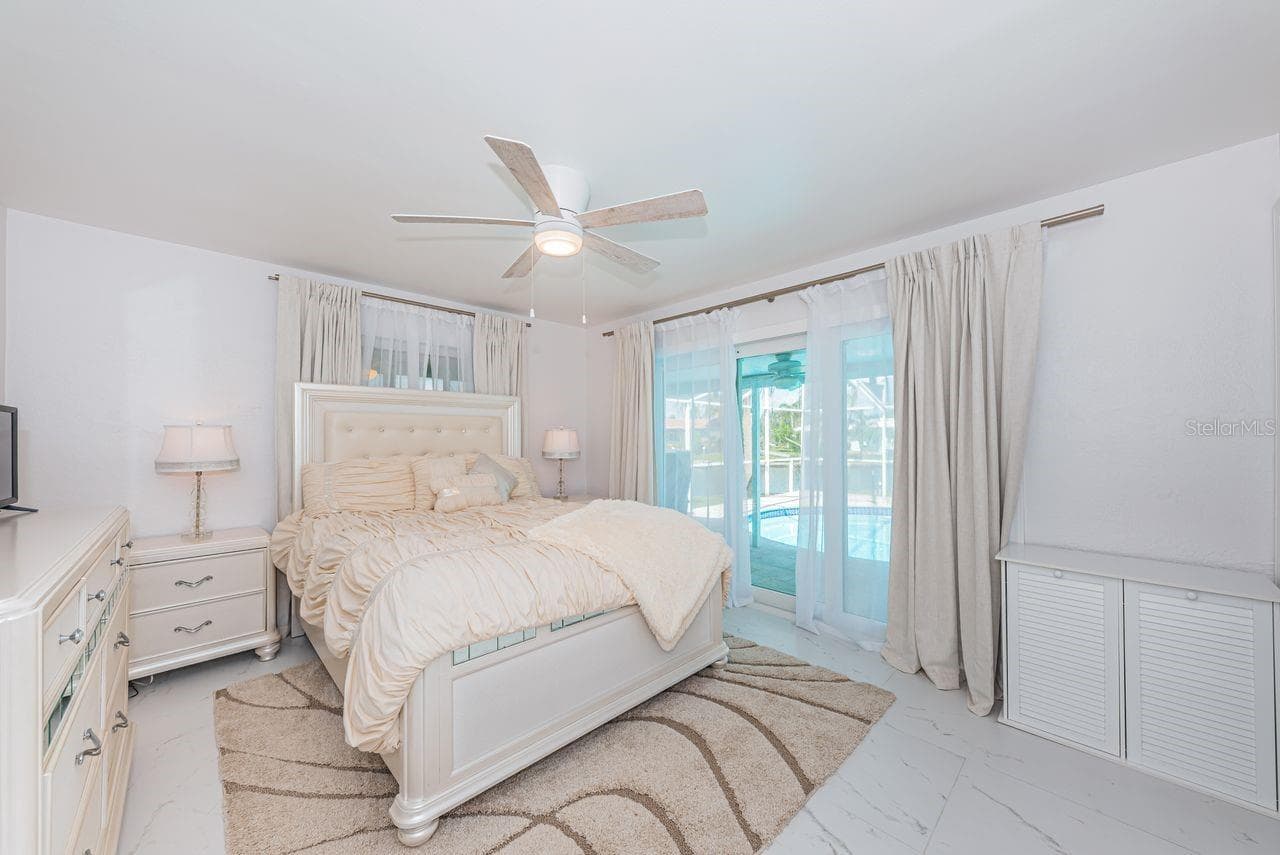 Bedroom 4 is an en suite with pool access - 4280 13TH LN NE, ST PETERSBURG