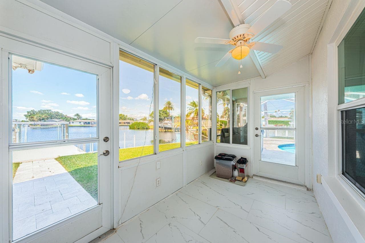 Enclosed back porch - 4280 13TH LN NE, ST PETERSBURG