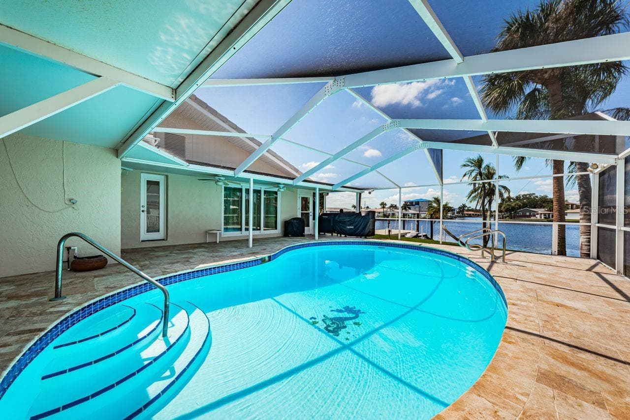 Multiple shady spaces to enjoy the pool - 4280 13TH LN NE, ST PETERSBURG