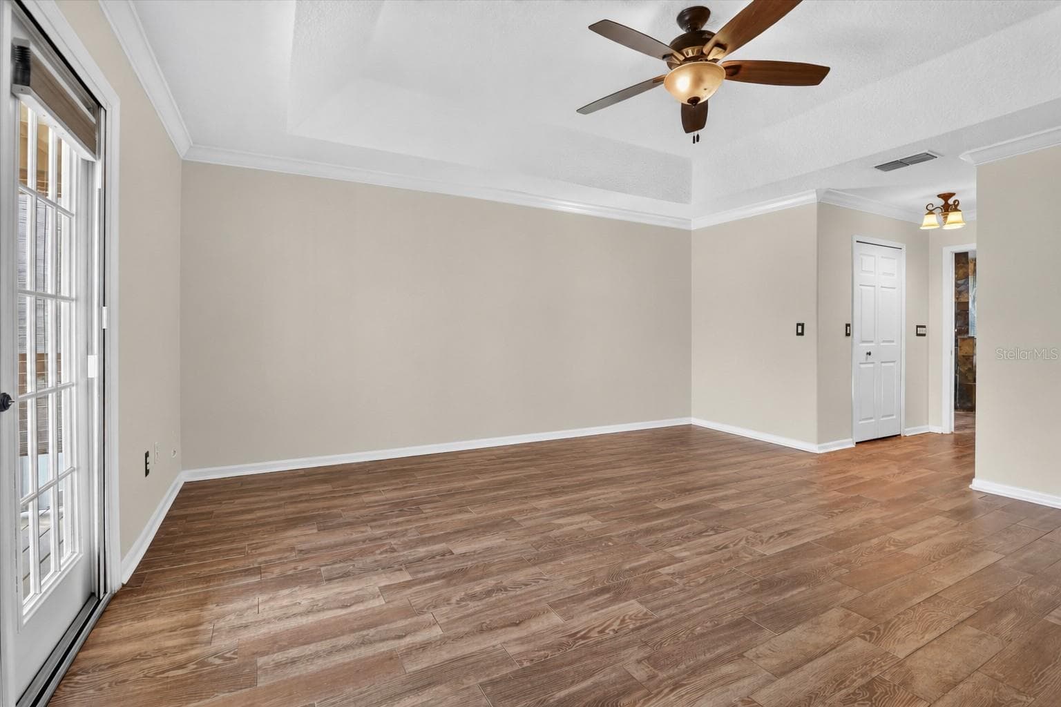 Not staged: Primary bedroom shown without furniture. - 2109 WEMBLEY PL, OVIEDO