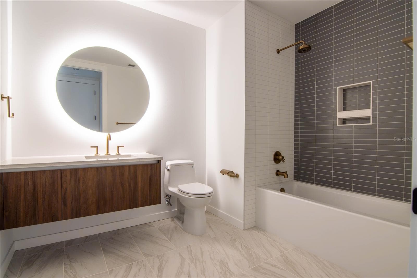 Hall bath with backlit mirror and floating vanity - 777 3RD AVE N #1503, ST PETERSBURG