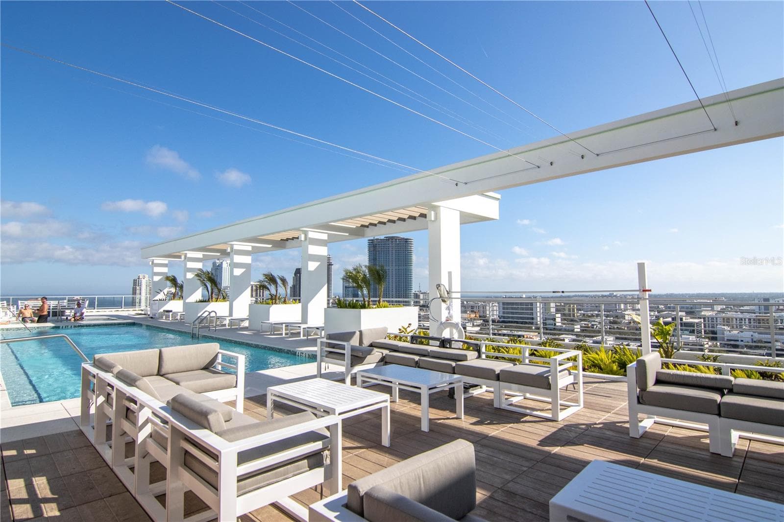 Outdoor dining space with see-through fireplace into the community room - 777 3RD AVE N #1503, ST PETERSBURG