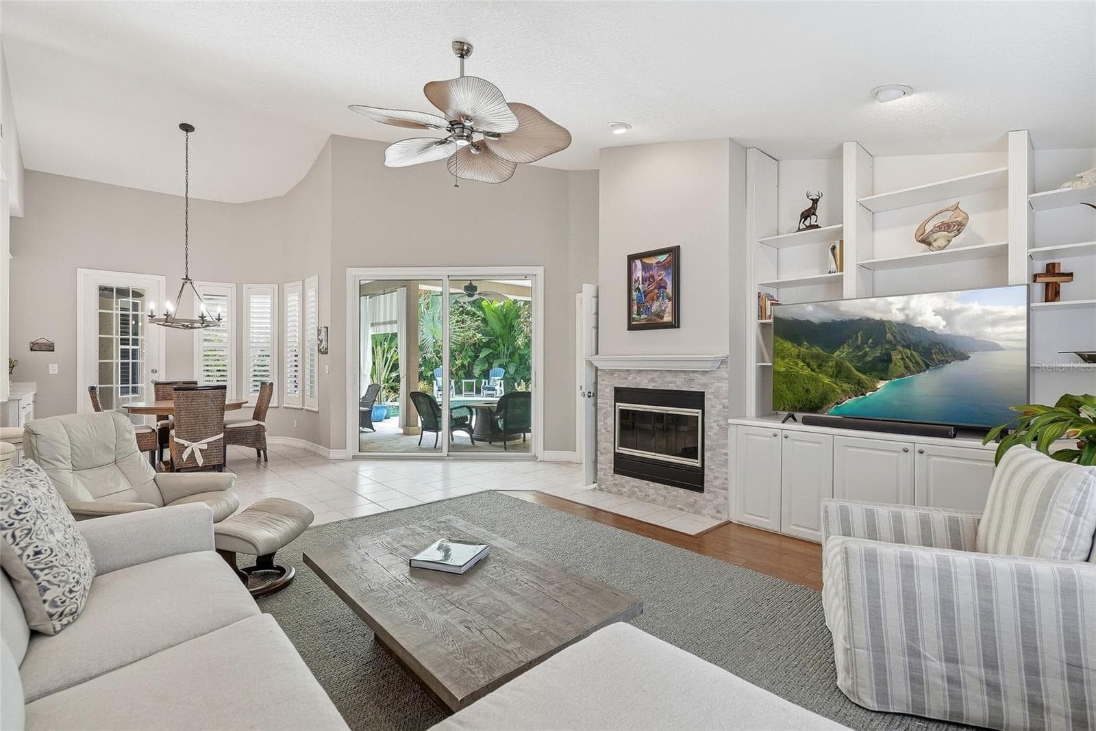 Large living room is central to the kitchen and dinette making it the anchor of the home. - 4851 WINDMILL PALM TER NE, ST PETERSBURG