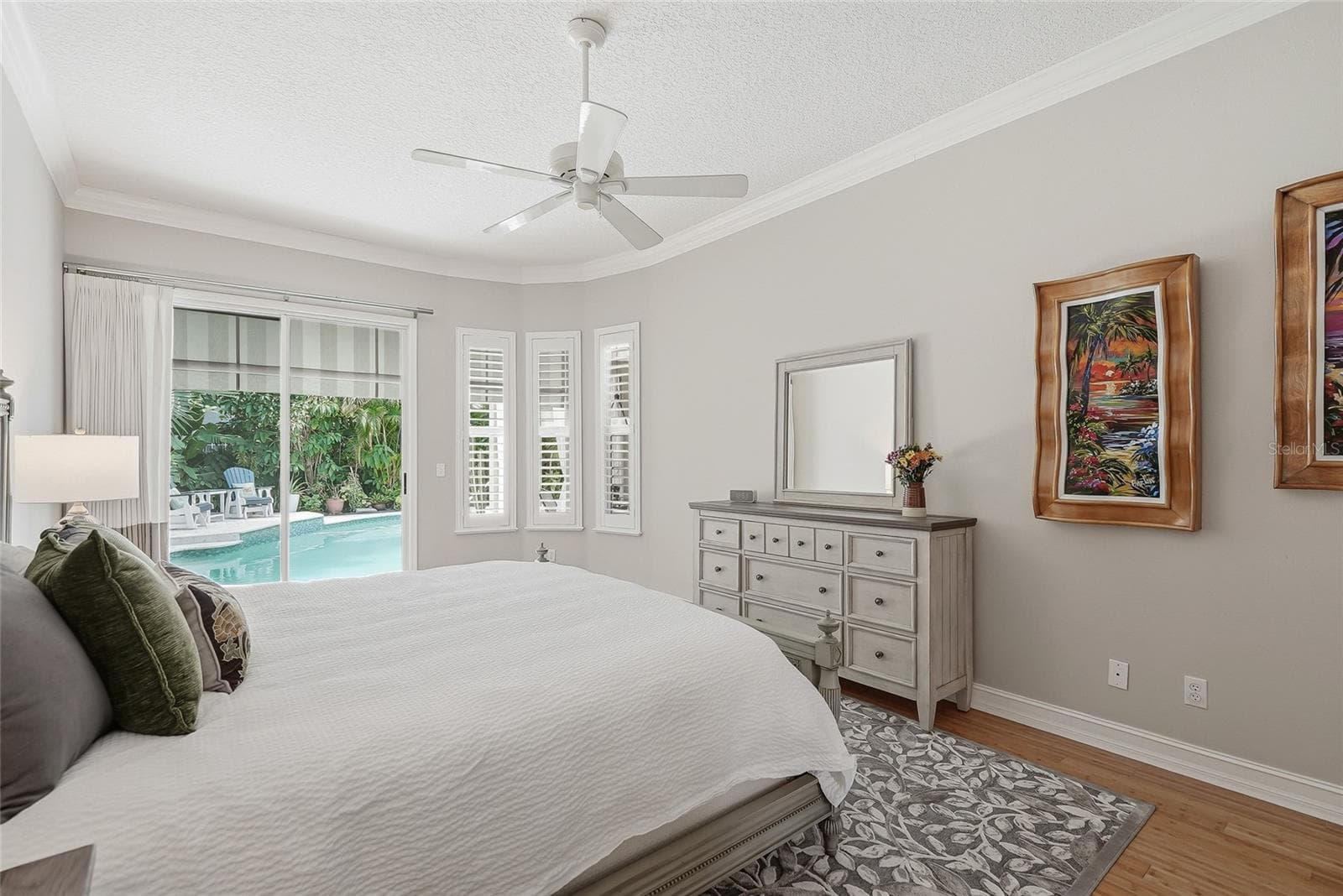 Primary bedroom has high ceilings accentuating the space. - 4851 WINDMILL PALM TER NE, ST PETERSBURG