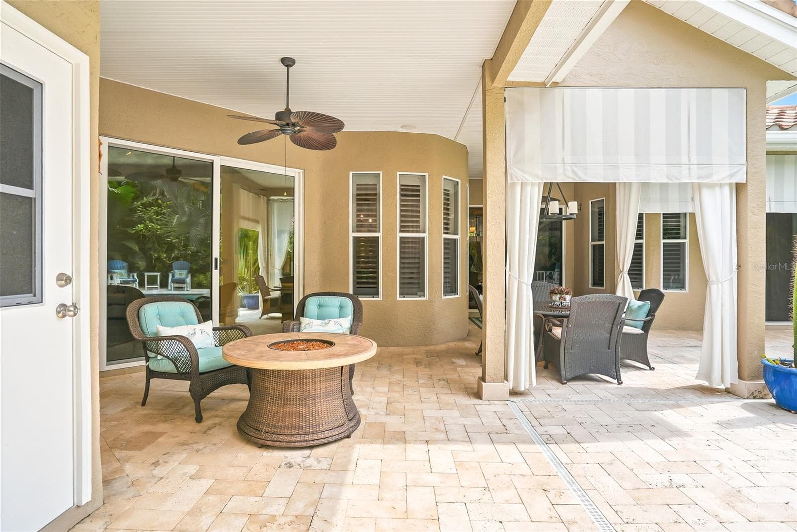 Separate area for a firepit, or two areas for multiple patio tables. - 4851 WINDMILL PALM TER NE, ST PETERSBURG