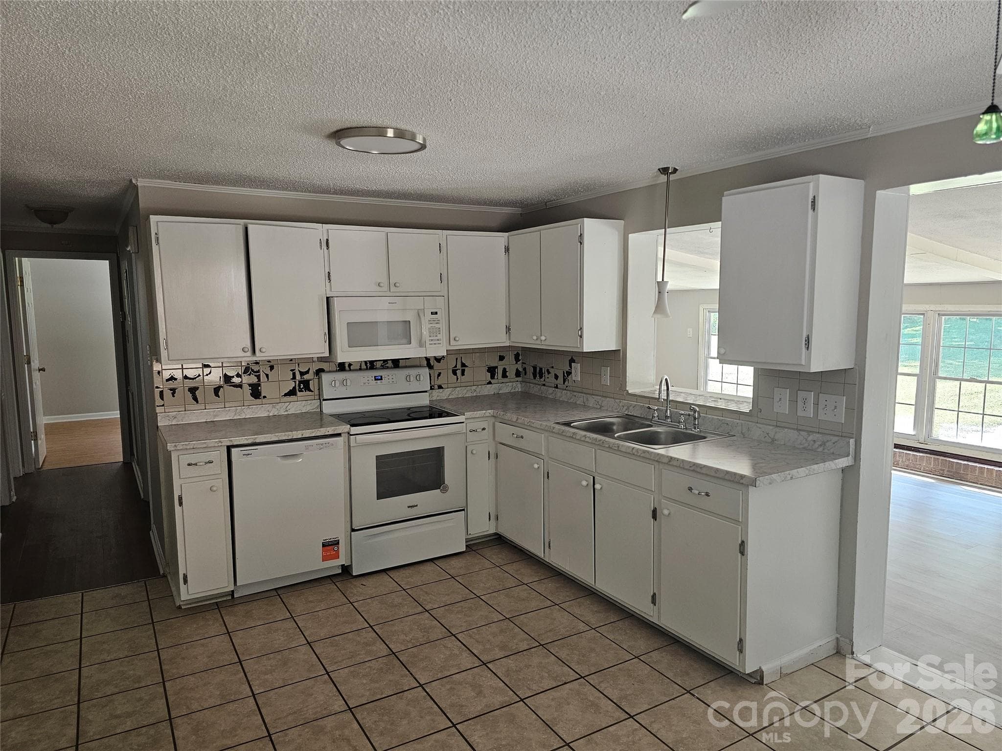 Kitchen with new dishwasher and microwave - 2782 West View Street, Hickory
