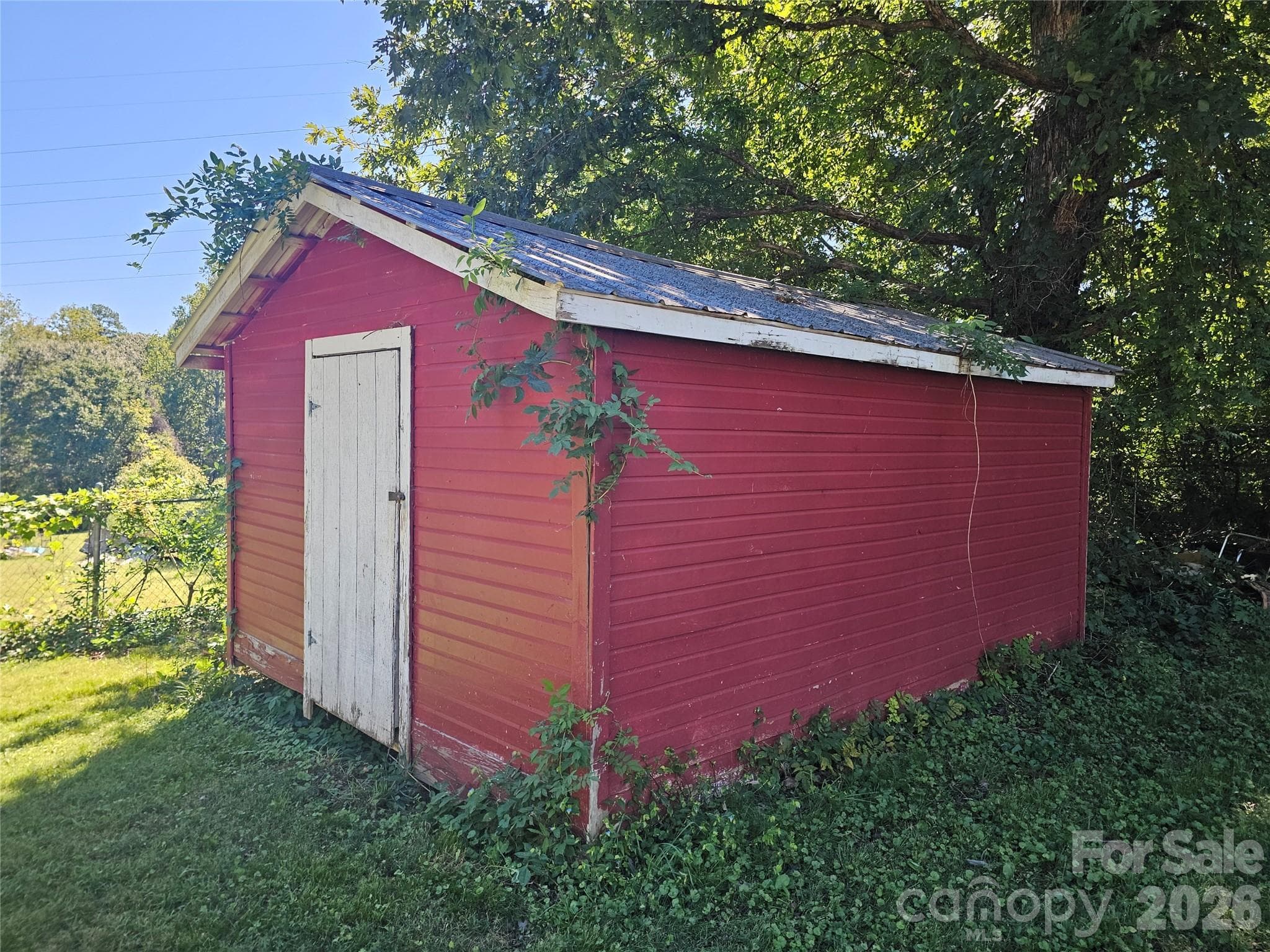 Large storage building in fenced back yard - 2782 West View Street, Hickory