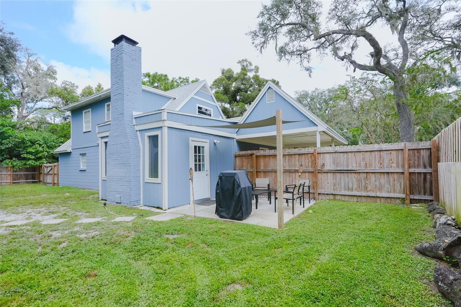 Back and patio - 16606 FOREST PARK DR, LUTZ