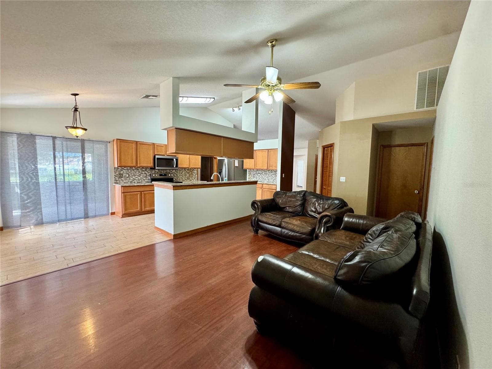 Living Room overlooking Dinette and Kitchen - 2207 DEATA CT, ST CLOUD