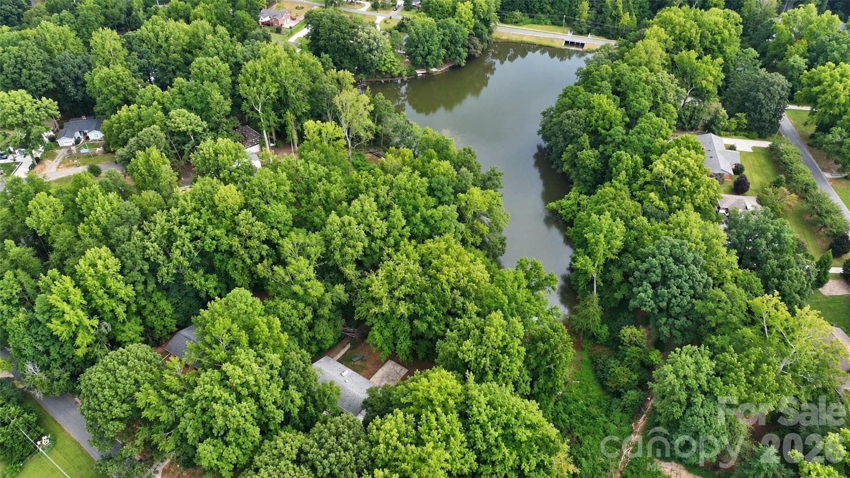 1.7 acres on waterfront lot.  Lot is big enough that it can be divided into 1-2 additional lots to build new construction.  Check with the city. - 7400 Oakwood Lane, Charlotte