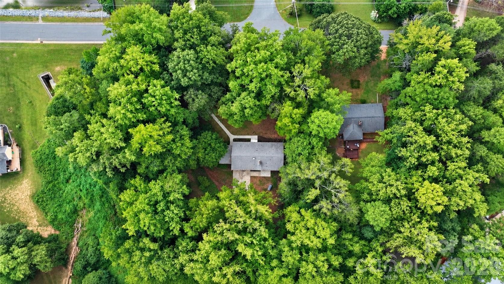 1.7 acres on waterfront lot.  Lot is big enough that it can be divided into 1-2 additional lots to build new construction.  Check with the city. - 7400 Oakwood Lane, Charlotte