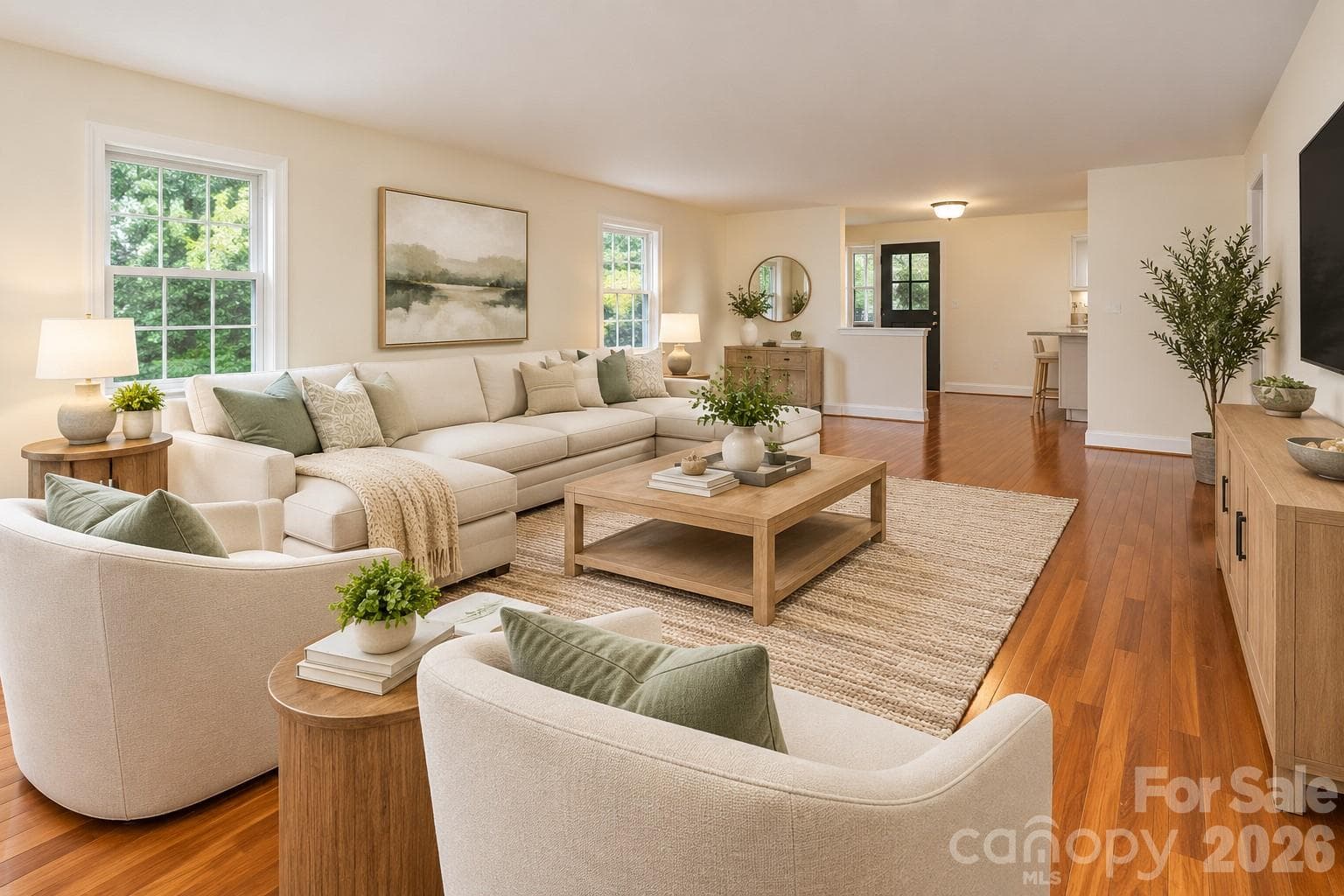 Spacious living area featuring an expansive open floor plan designed to accommodate a variety of furniture arrangements and décor styles.  Photo has been decorated by AI to show what it could look like furnished. - 7400 Oakwood Lane, Charlotte