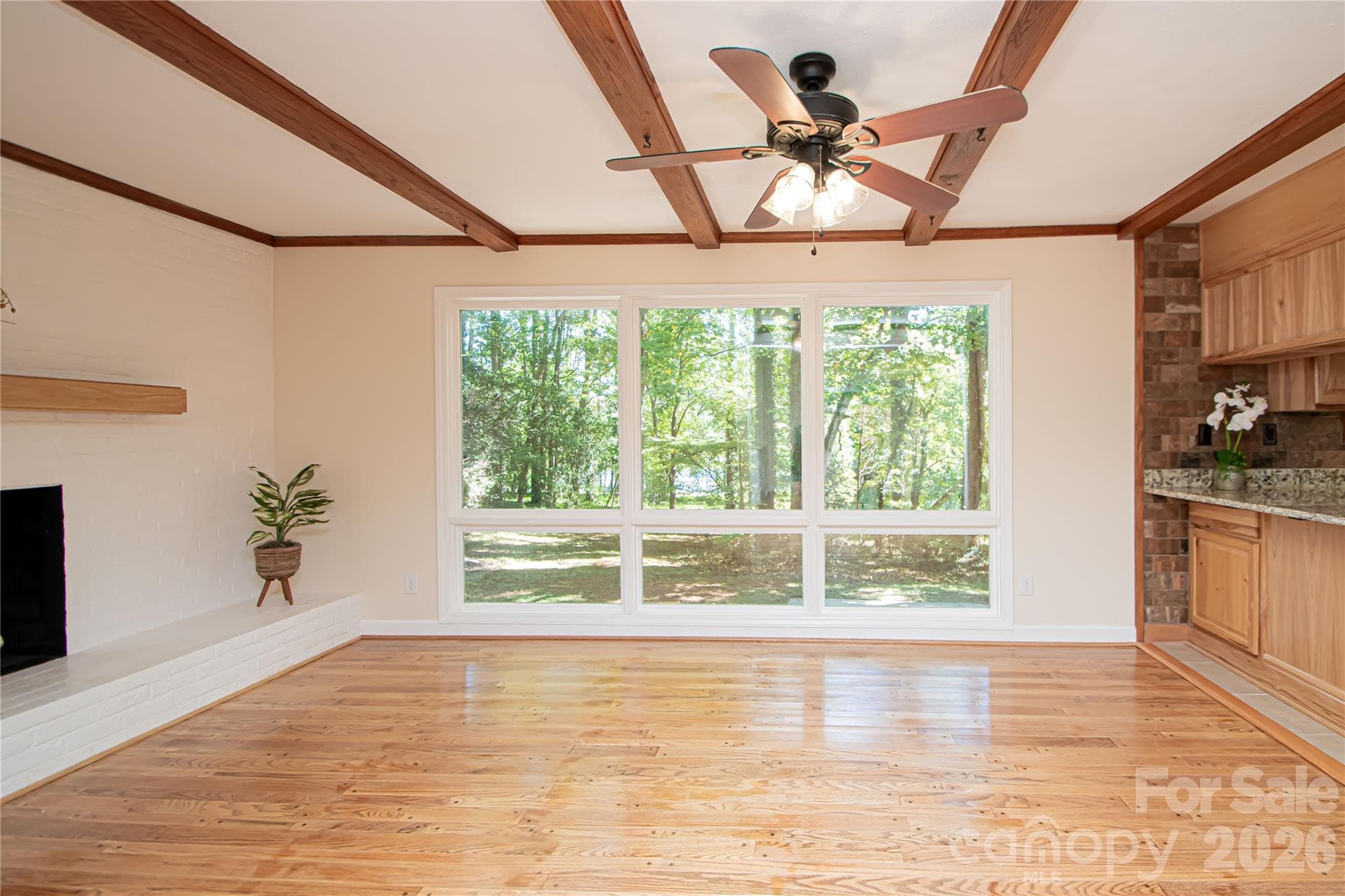 Enjoy this beautiful view of the lake while enjoying your dinner or sitting by the fireplace. - 7400 Oakwood Lane, Charlotte
